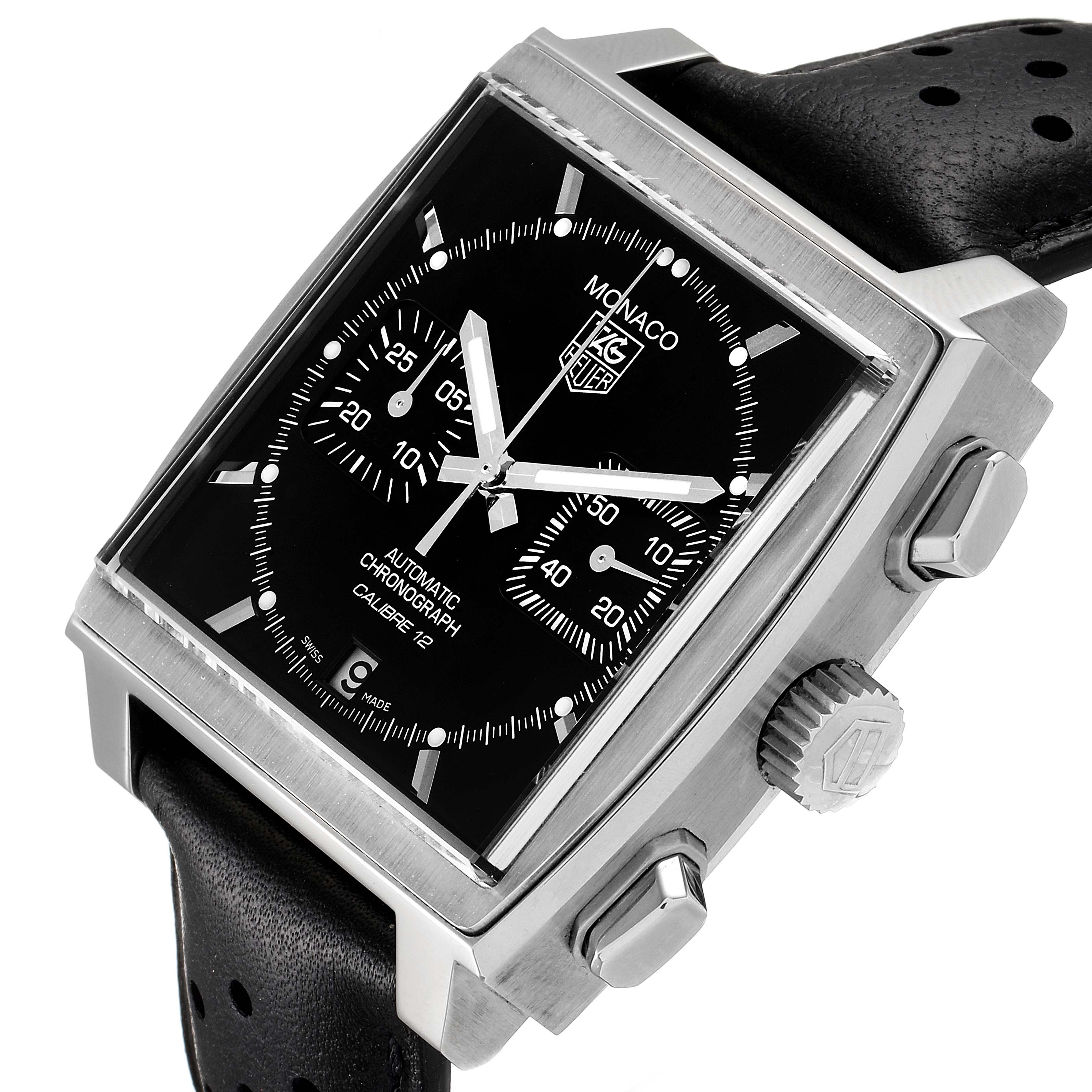 The image displays a Tag Heuer Monaco CAW2110.FC6177 Men's Stainless Steel Black Dial CAW2110.FC6177 Men's Stainless Steel Black Dial watch at a slightly tilted angle, highlighting its square face, crown, and push buttons.