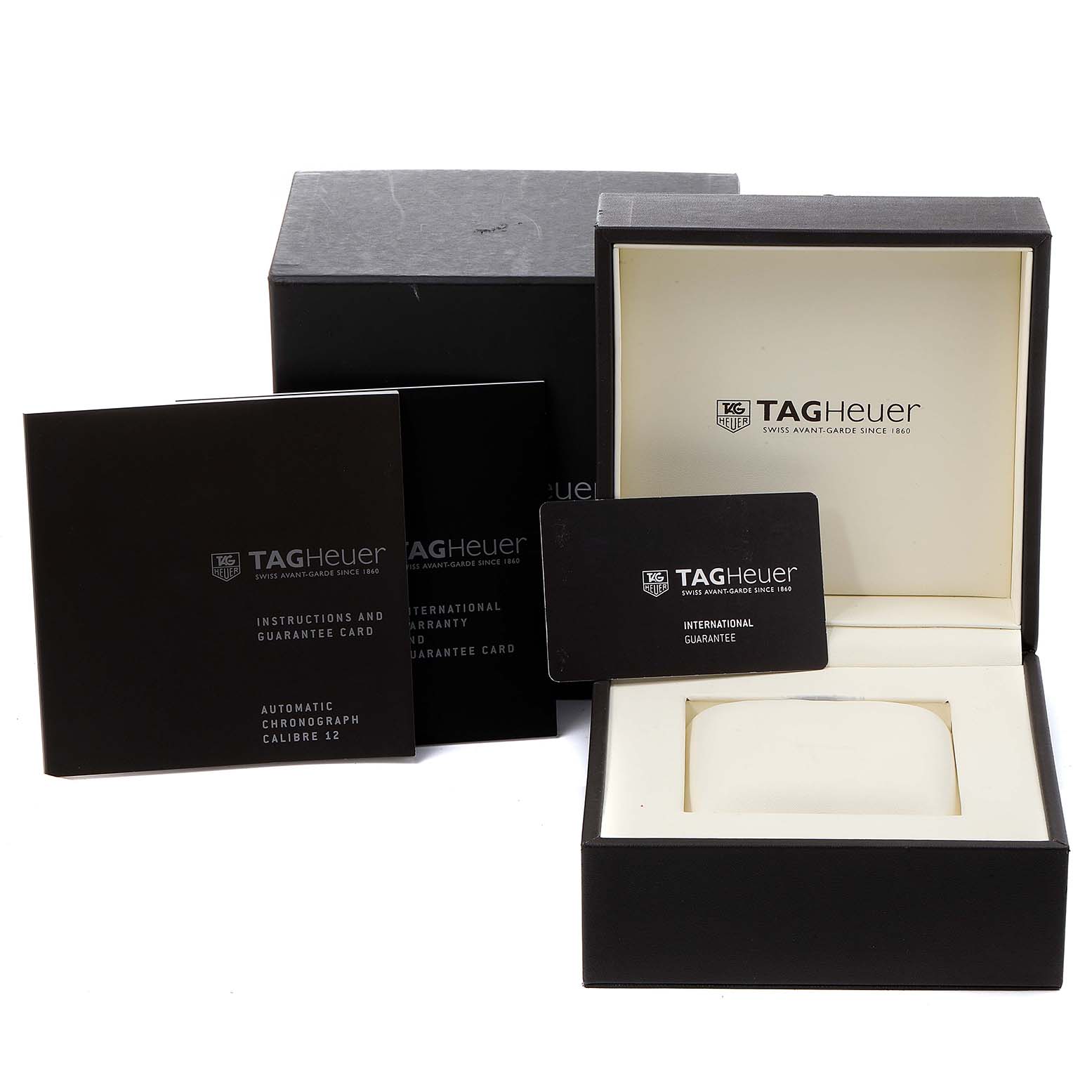 The image showcases the Tag Heuer Monaco CAW2110.FC6177 Men's Stainless Steel Black Dial CAW2110.FC6177 Men's Stainless Steel Black Dial watch's packaging, including the watch box, guarantee card, and instruction manual.