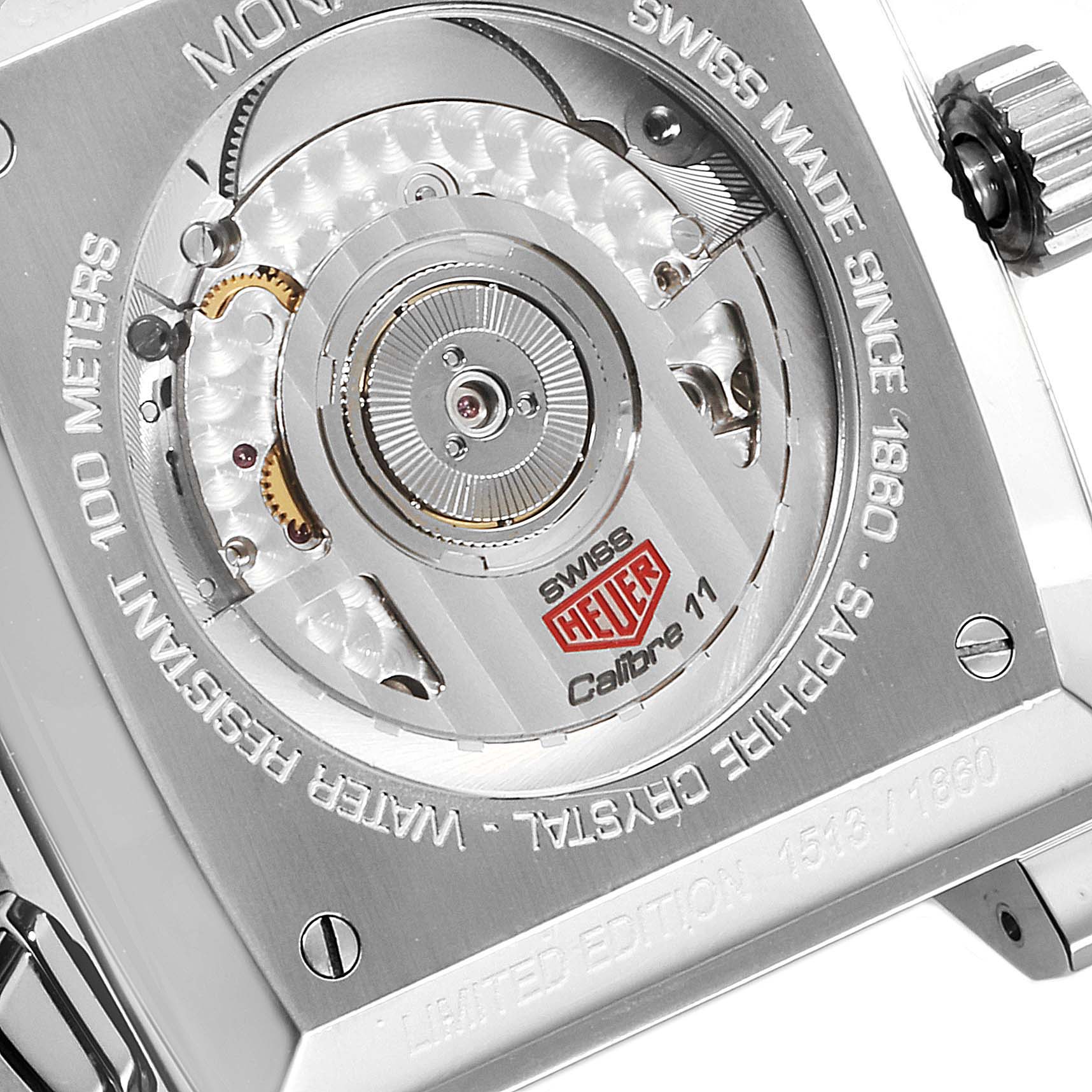 The image shows the back view of a Tag Heuer Limited Edition CAW211B Men's Stainless Steel Grey Dial CAW211B Men's Stainless Steel Grey Dial Calibre 11 watch, highlighting the movement and inscriptions.