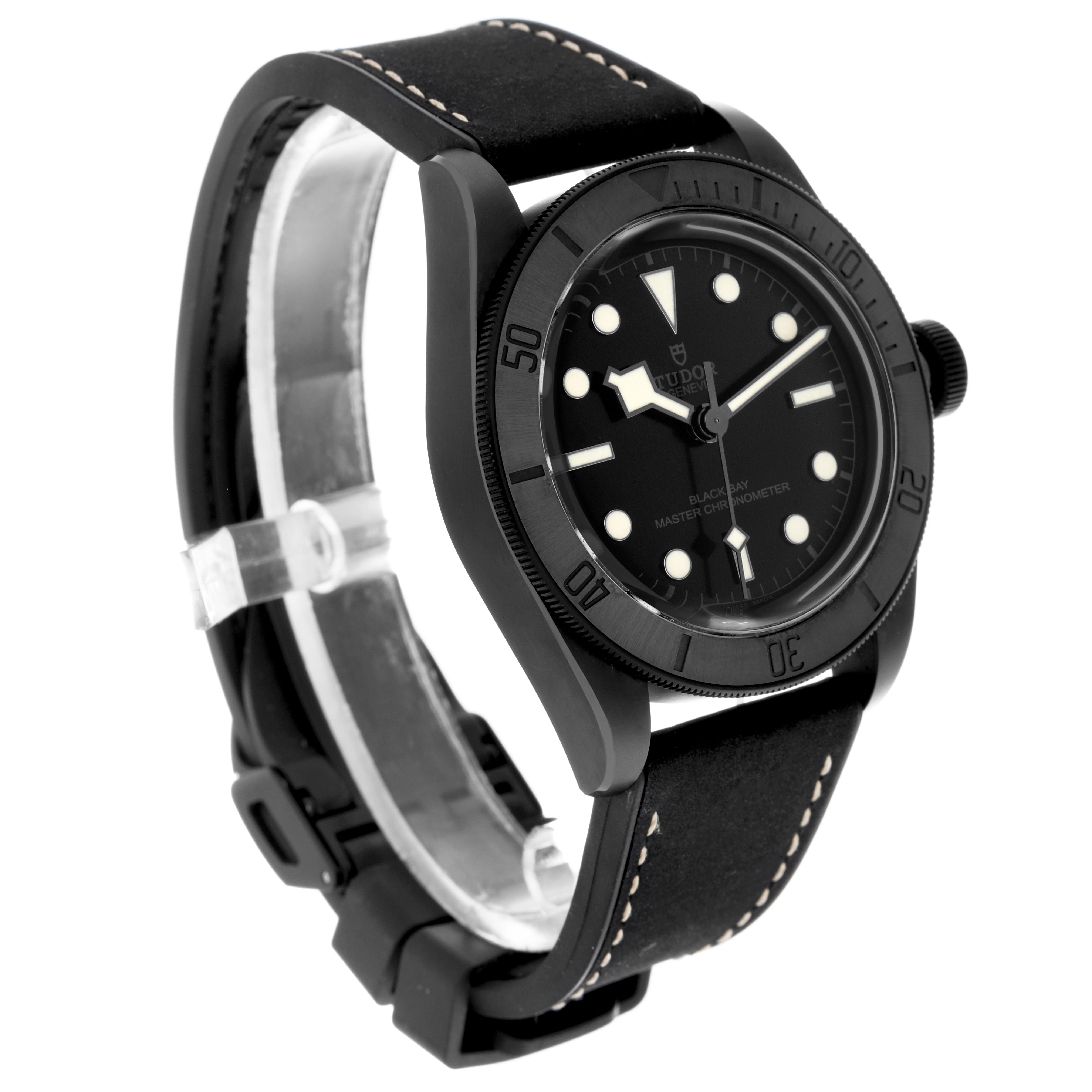 The Tudor Heritage Black Bay 79210 Men
s Ceramic Black Dial 79210 Men
s Ceramic Black Dial watch is shown in a three-quarter angle, highlighting the black dial, bezel, and leather strap.