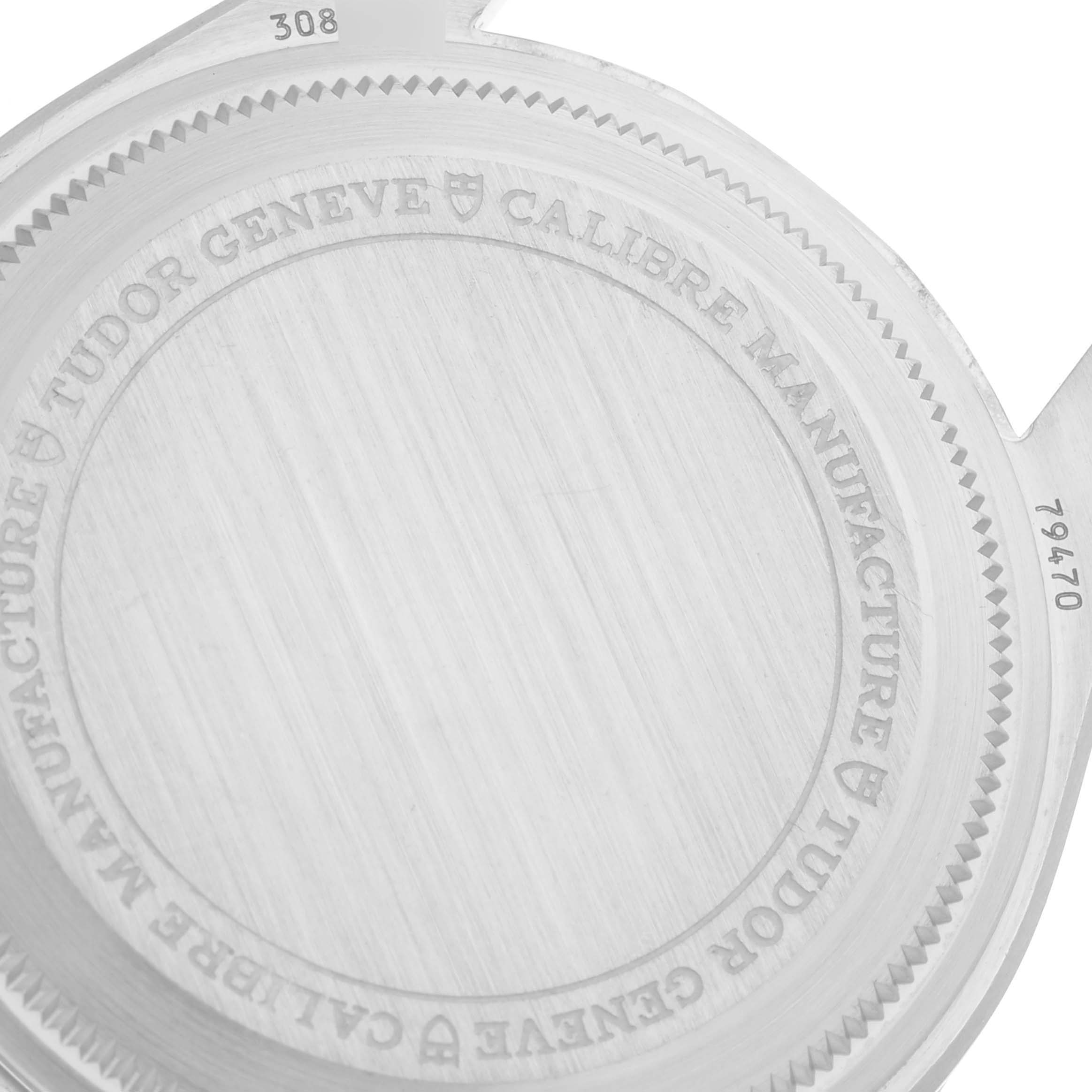 The image shows the back case of a Tudor Heritage Black Bay M79470-001 Men
s Stainless Steel Black Dial M79470-001 Men
s Stainless Steel Black Dial watch with engraved details.