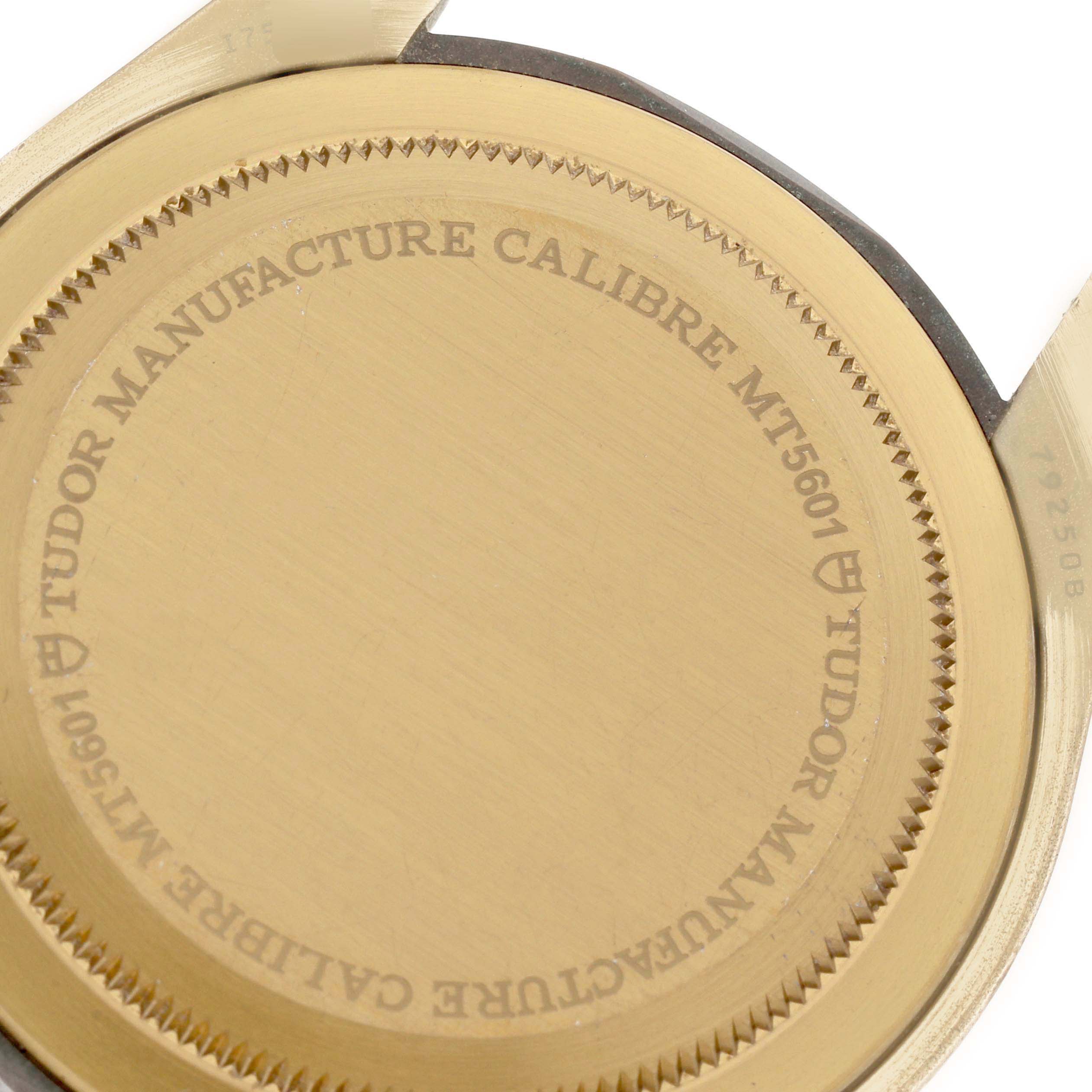 The image shows the case back of the Tudor Heritage Black Bay 79250B Men's Bronze Brown Dial 79250B Men's Bronze Brown Dial watch, featuring the "TUDOR MANUFACTURE CALIBRE MT5601" engraving.