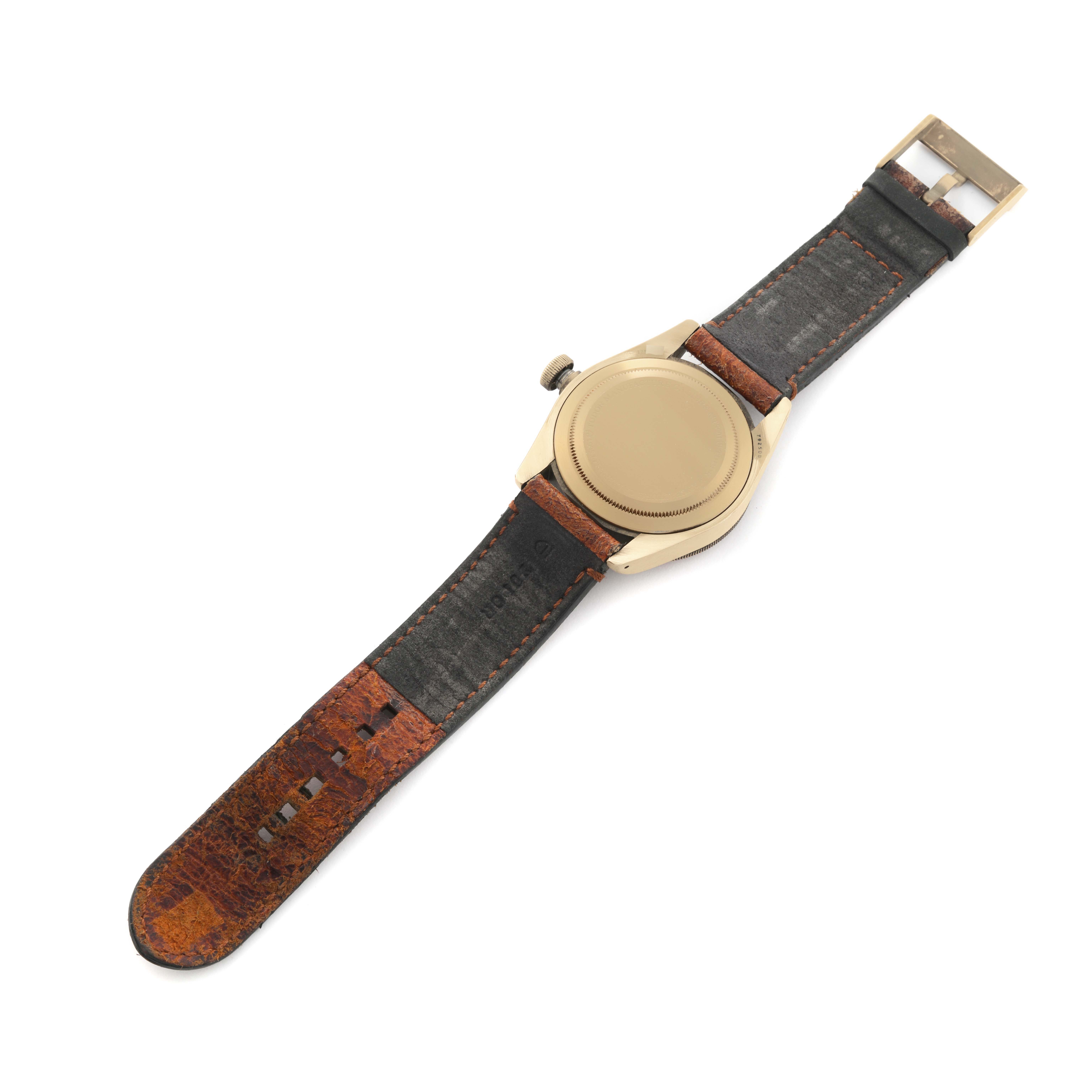 The image shows the back view of a Tudor Heritage Black Bay 79250B Men's Bronze Brown Dial 79250B Men's Bronze Brown Dial watch with its strap fully extended.