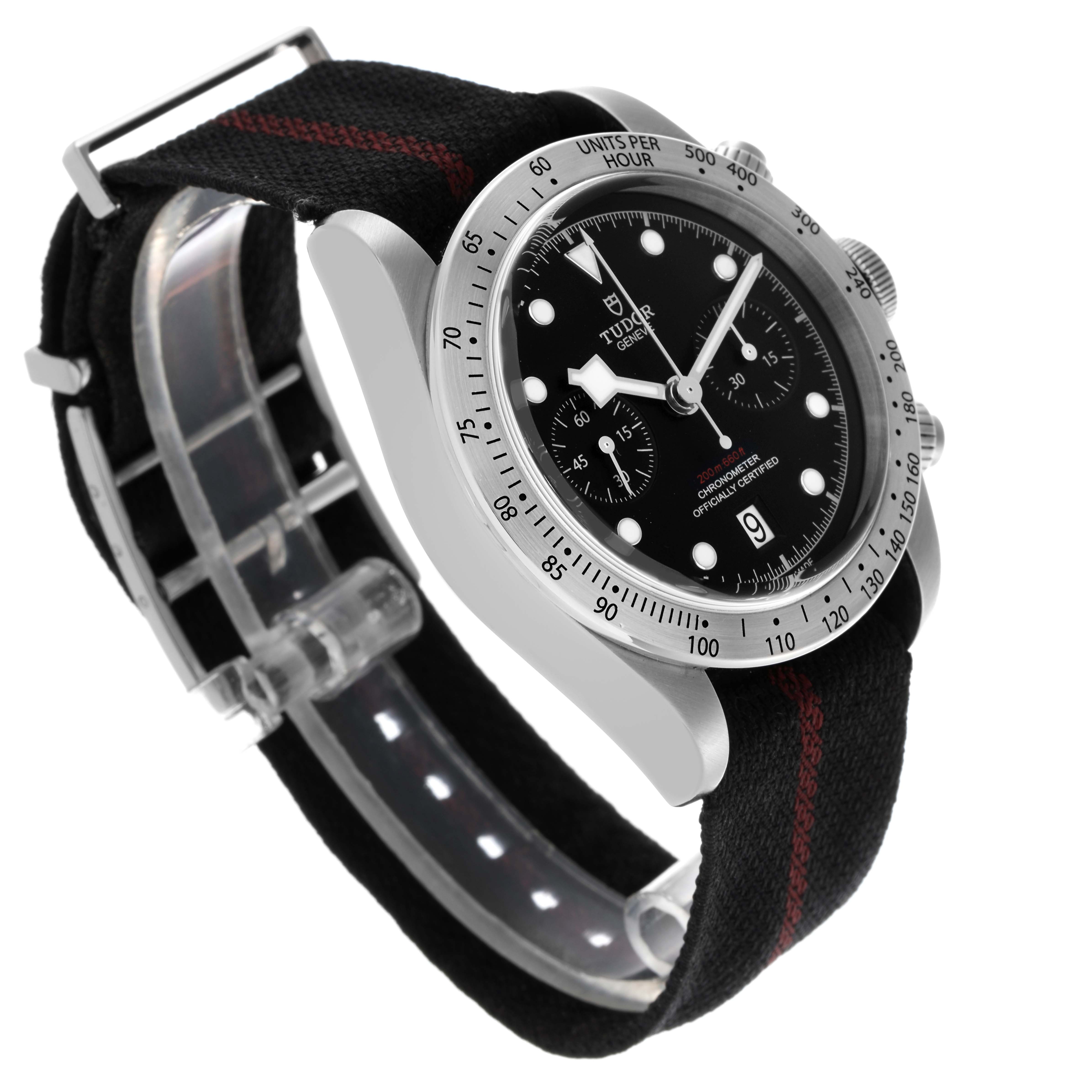 The Tudor Heritage Black Bay 79350 Men
s Stainless Steel Black Dial 79350 Men
s Stainless Steel Black Dial watch is shown from a side angle, displaying its face, bezel, and fabric strap.