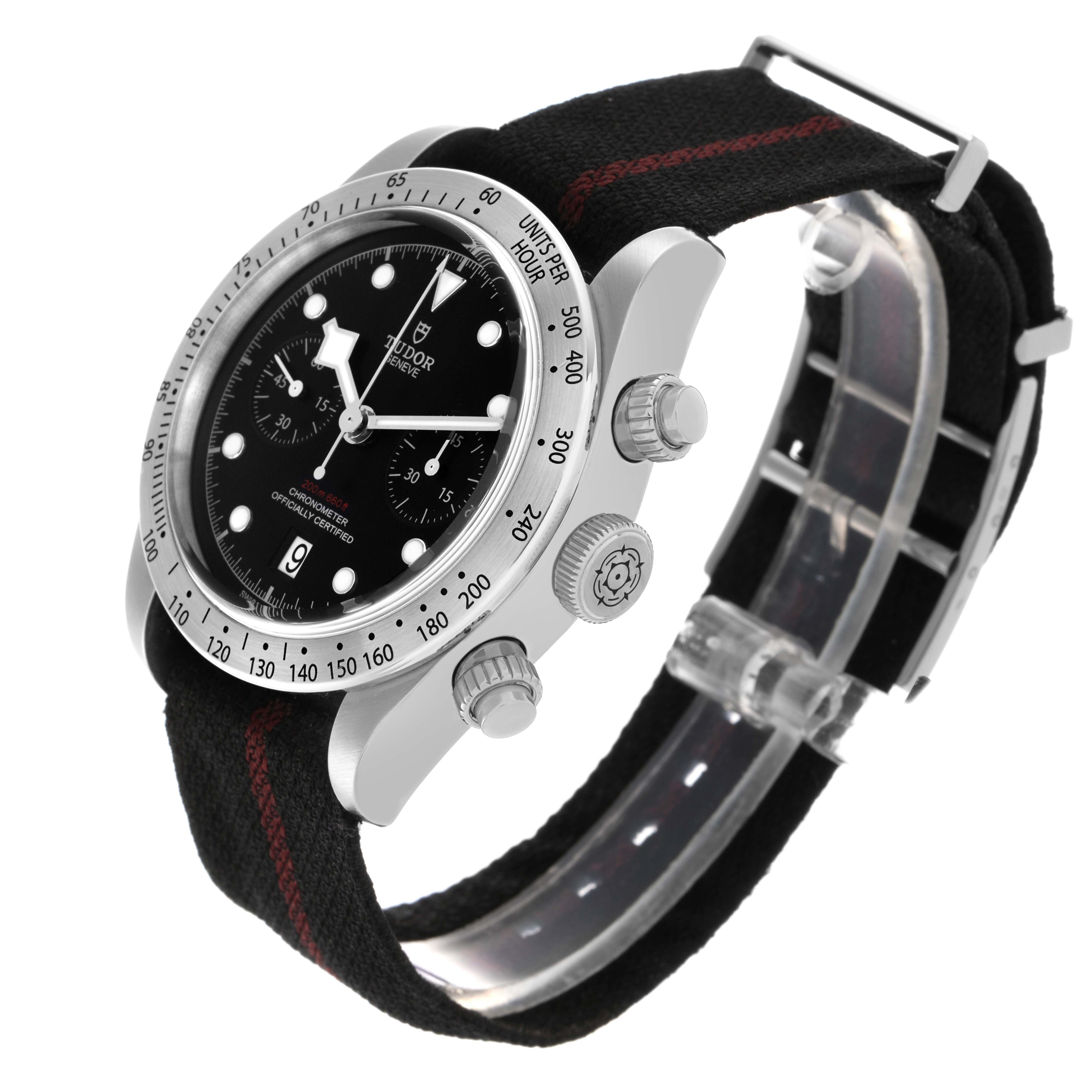 The Tudor Heritage Black Bay 79350 Men
s Stainless Steel Black Dial 79350 Men
s Stainless Steel Black Dial watch is angled to show the case, bezel, crown, chronograph pushers, and fabric strap with a metal clasp.