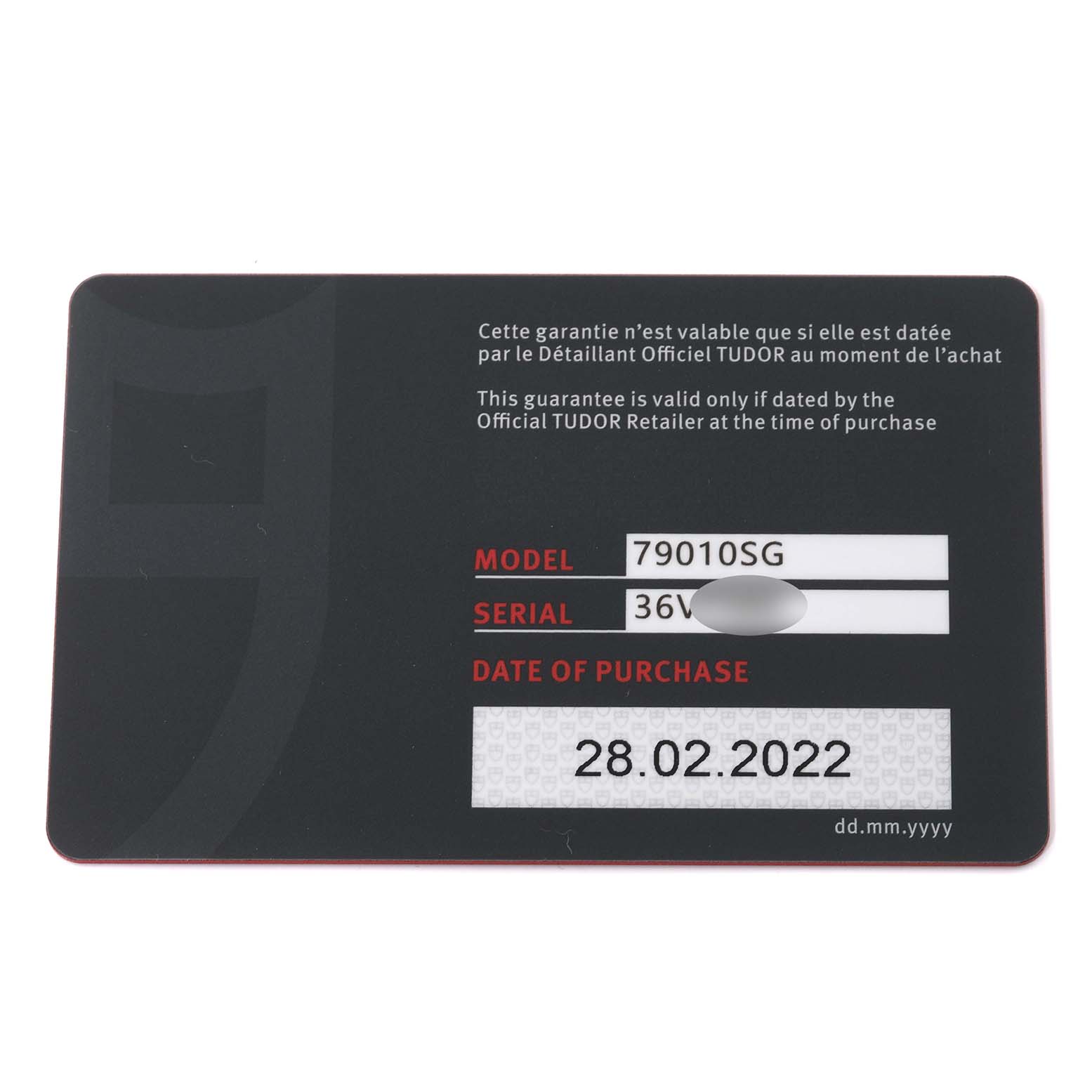 The image shows a warranty card for the Tudor Heritage Black Bay 79010SG Men
s Stainless Steel Grey Dial 79010SG Men
s Stainless Steel Grey Dial model 79010SG, displaying the model number, serial number, and purchase date.