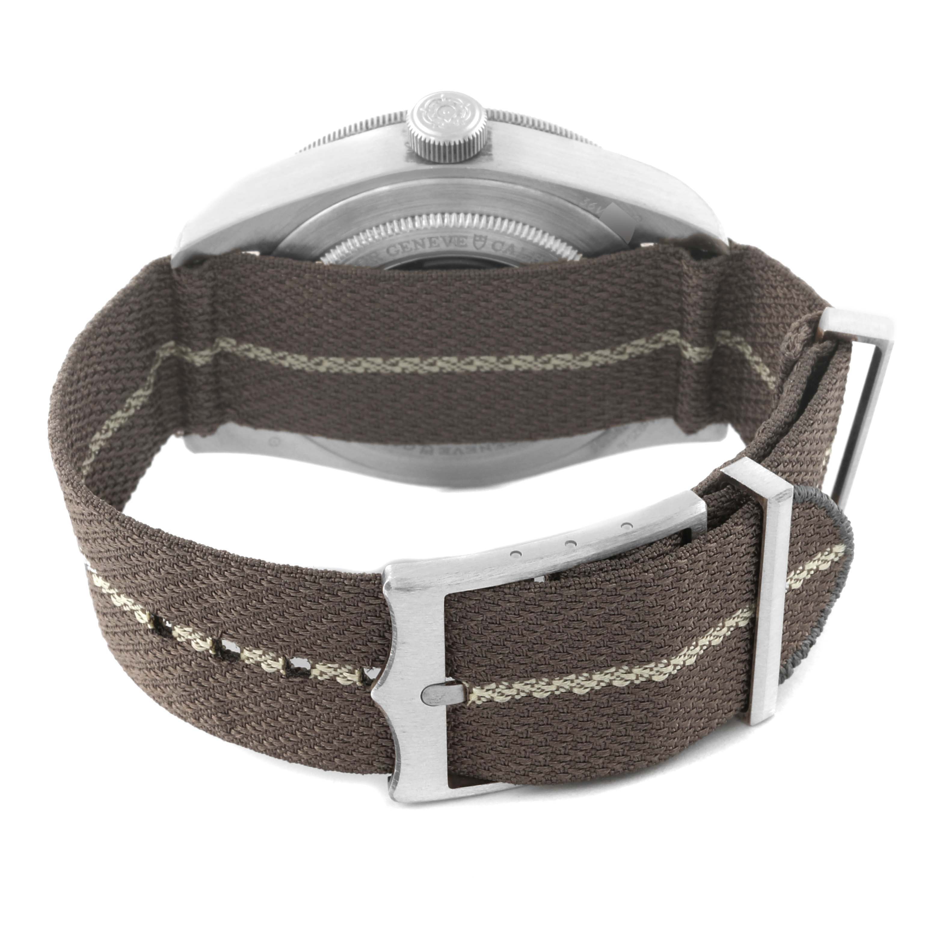 This is a rear view of the Tudor Heritage Black Bay 79010SG Men
s Stainless Steel Grey Dial 79010SG Men
s Stainless Steel Grey Dial watch, focusing on the fabric strap and its buckle.
