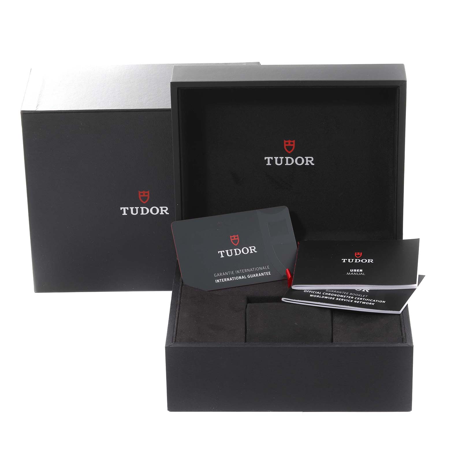 The image shows Tudor Heritage Black Bay 79010SG Men
s Stainless Steel Grey Dial 79010SG Men
s Stainless Steel Grey Dial watch packaging, including the box, warranty card, user manual, and certification booklet.