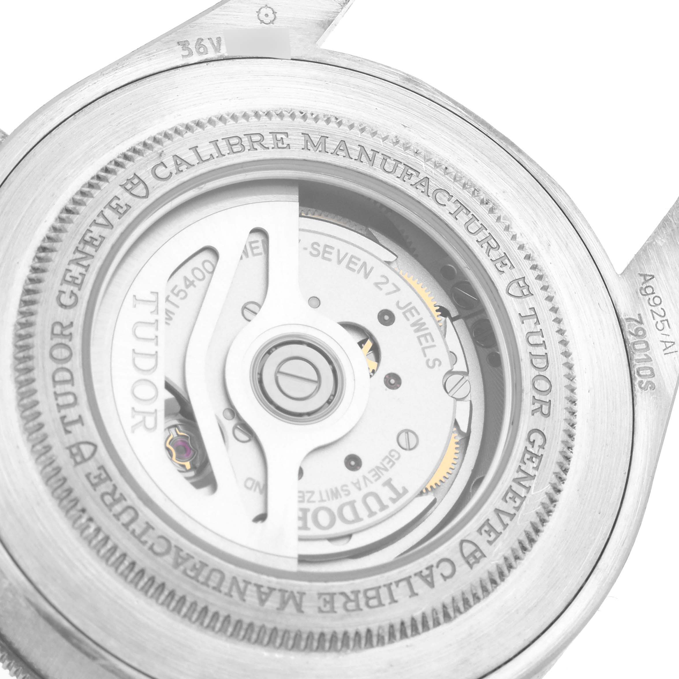 This image shows the back of the Tudor Heritage Black Bay 79010SG Men
s Stainless Steel Grey Dial 79010SG Men
s Stainless Steel Grey Dial watch, revealing its mechanical movement components and engravings.