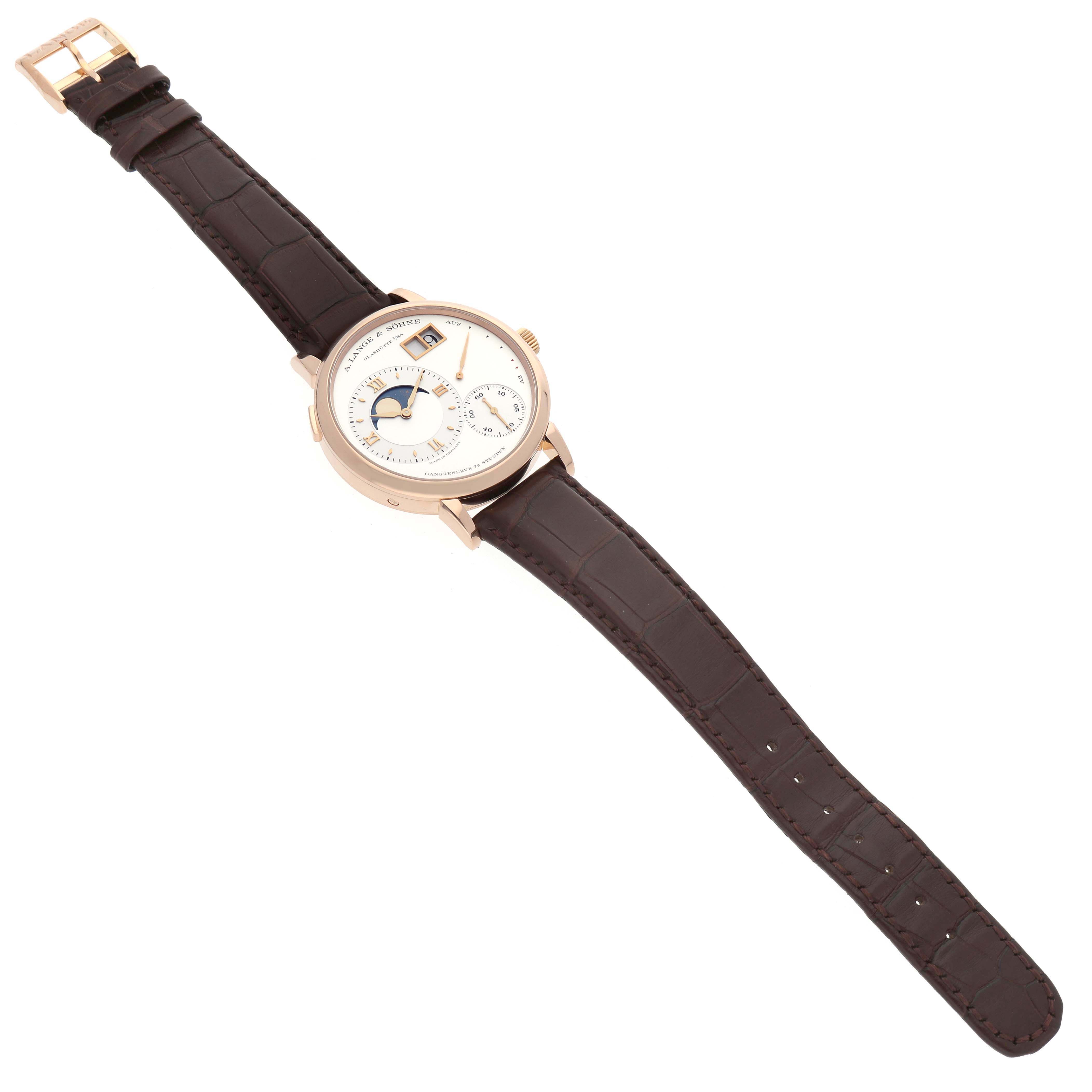 The Lange 1 by A. Lange & Söhne is shown at a slight diagonal angle, displaying its round face and entire leather strap.