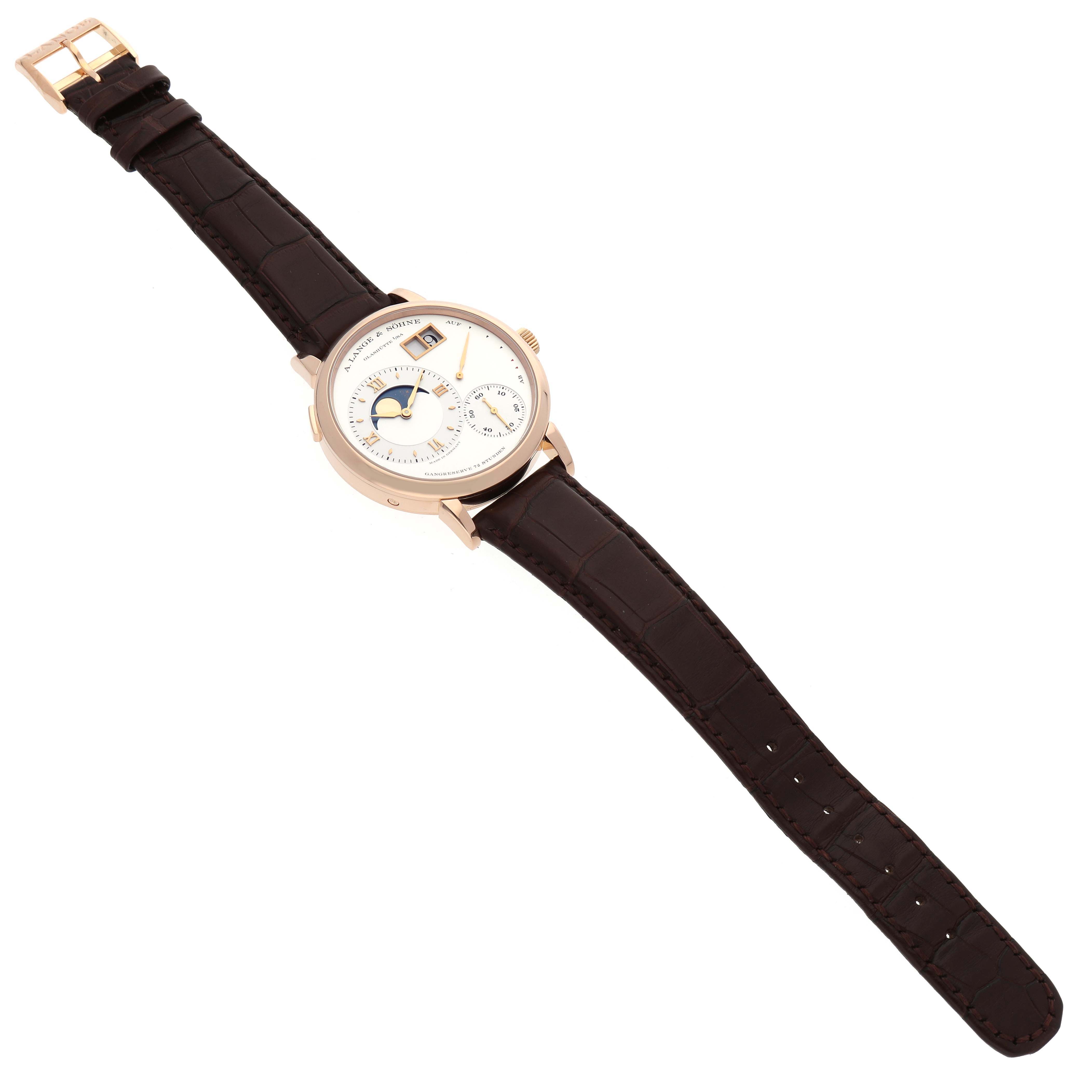The Lange 1 model by A. Lange & Söhne is shown in a top-down angle, displaying its face and full leather strap.