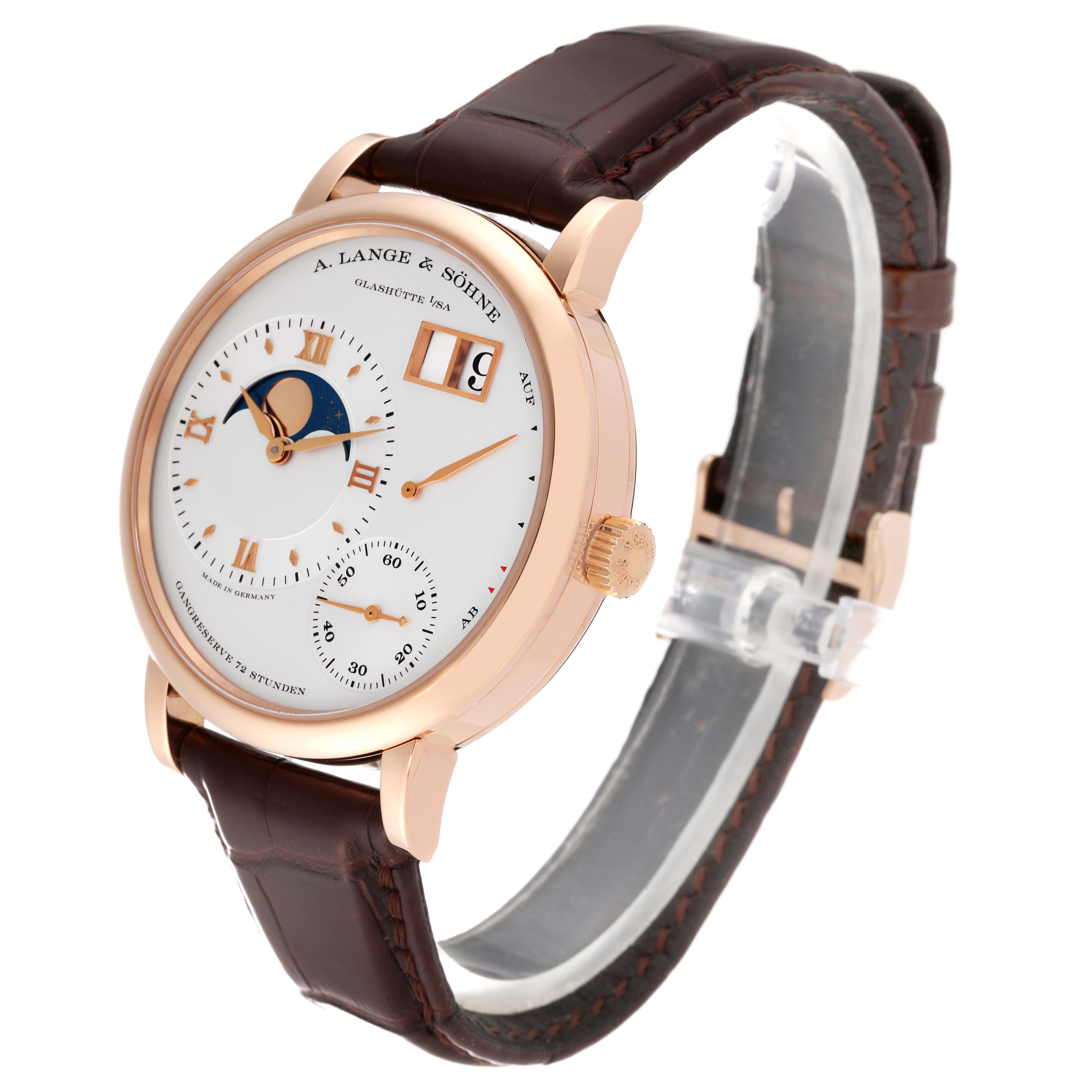 The Lange 1 by A. Lange & Söhne is shown at a slight angle, featuring its dial, crown, and leather strap.