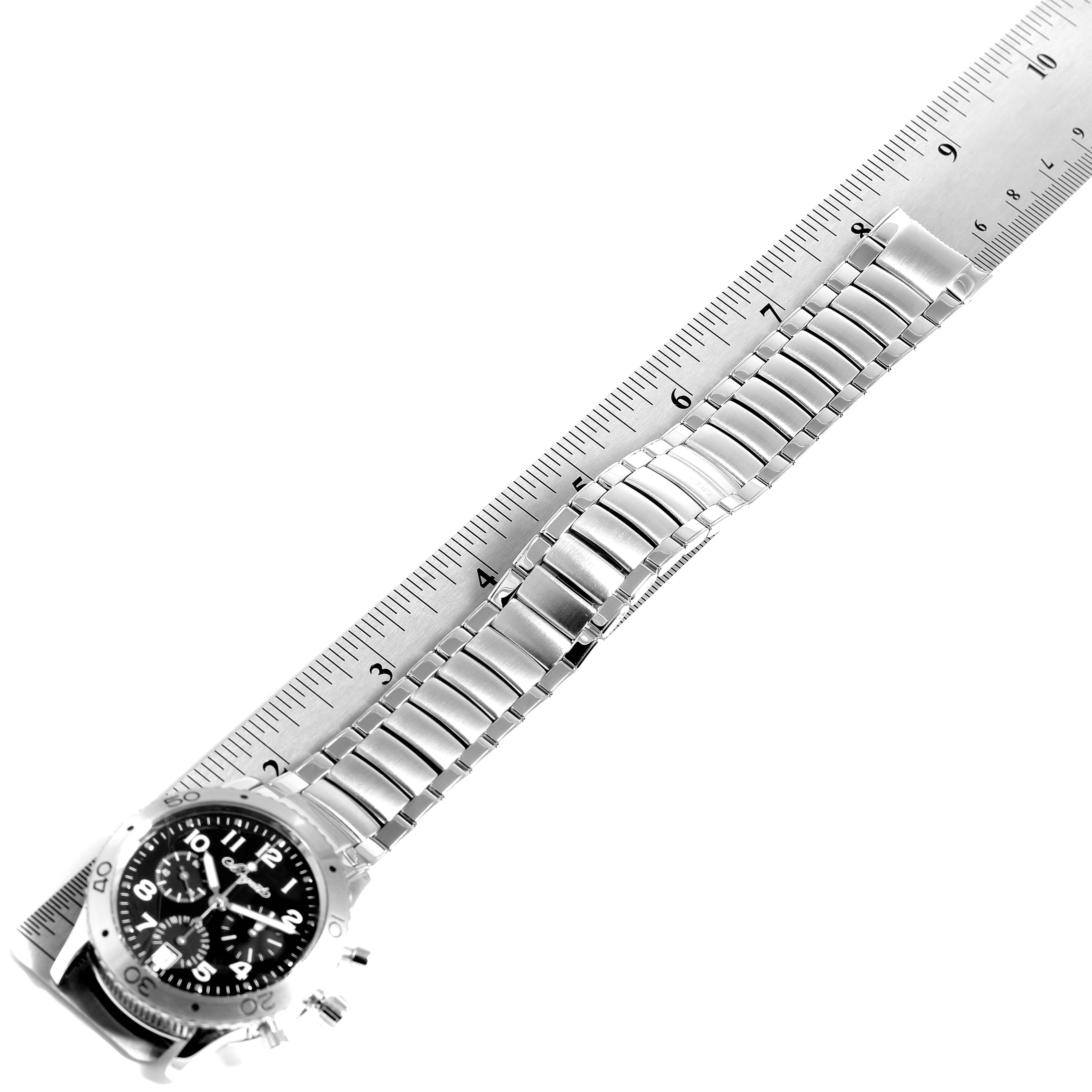 The image shows a Breguet Type XX - XXI - XXII 3820ST/H2/SW9 Men's Stainless Steel Black Dial 3820ST/H2/SW9 Men's Stainless Steel Black Dial watch at a diagonal angle, with the entire bracelet and part of the case face visible, next to a ruler.
