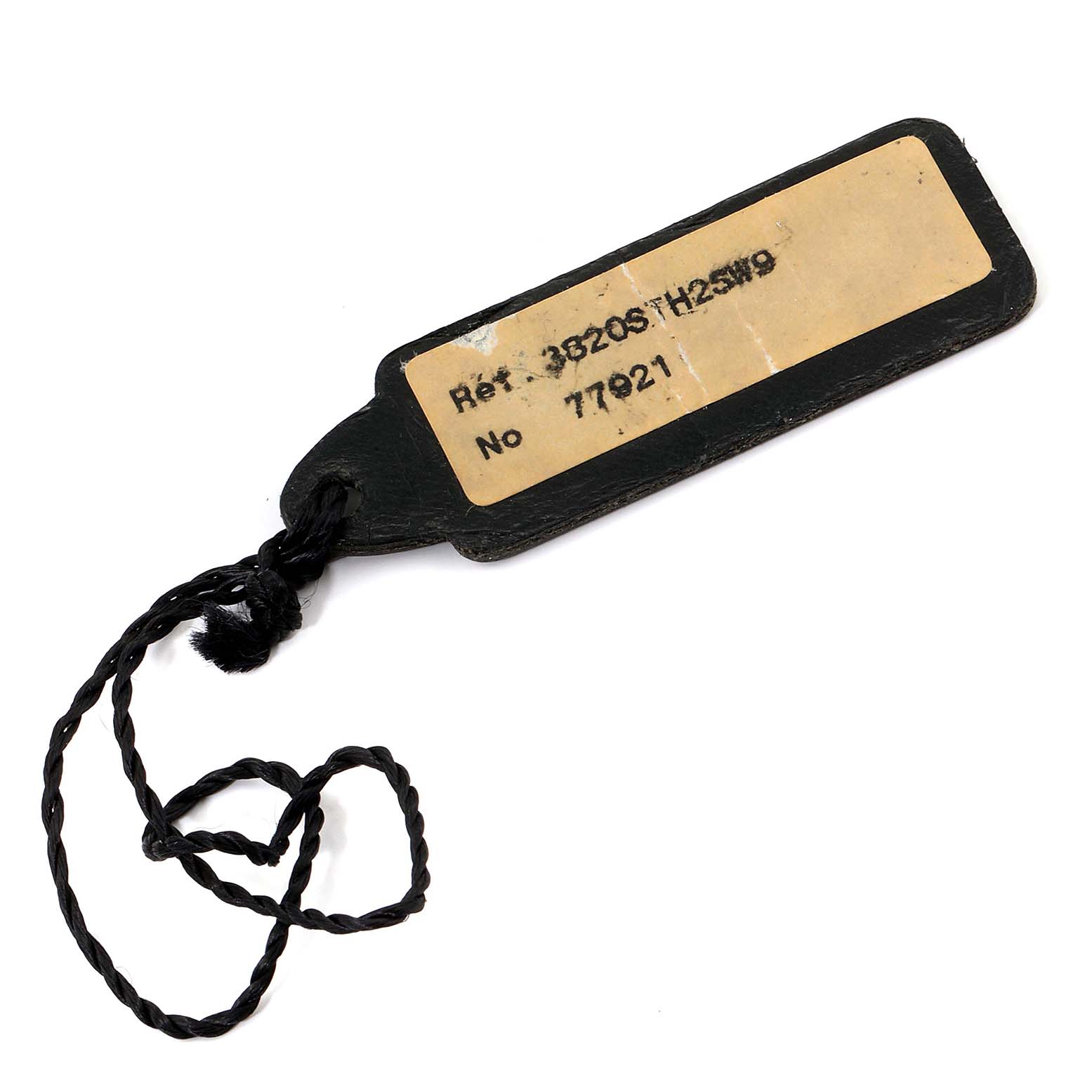 This image shows a close-up of a Breguet Type XX - XXI - XXII 3820ST/H2/SW9 Men's Stainless Steel Black Dial 3820ST/H2/SW9 Men's Stainless Steel Black Dial watch tag with reference number and serial number visible.