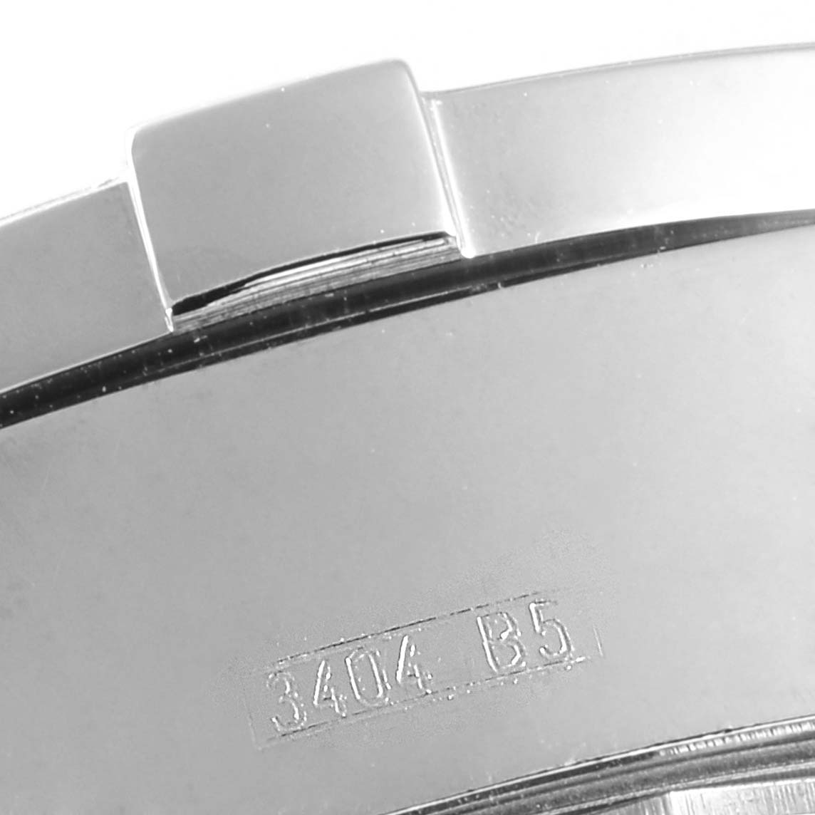 The image shows a close-up of the band or clasp of a Breitling Superocean A13340 Men's Stainless Steel Beige Dial A13340 Men's Stainless Steel Beige Dial watch, highlighting a stamped serial number.