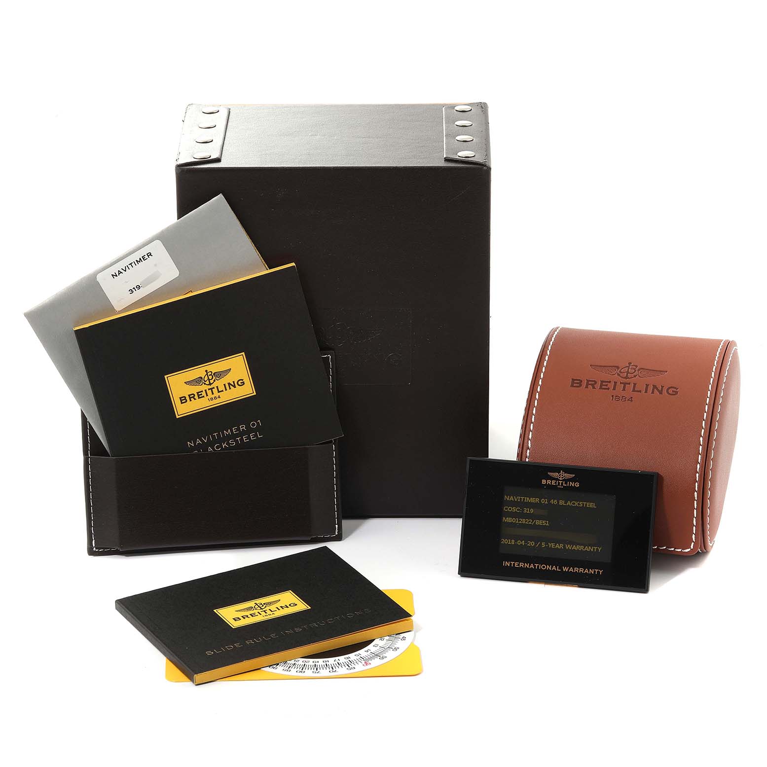 The image shows the packaging, warranty card, and case of a Breitling Navitimer MB012822/BE51 Men
s Stainless Steel Black Dial MB012822/BE51 Men
s Stainless Steel Black Dial watch.