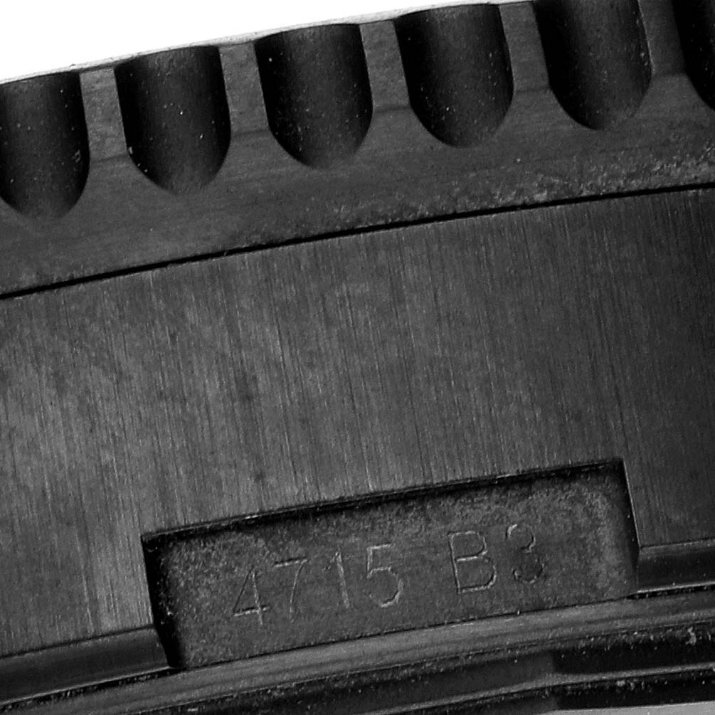 This close-up image shows the bezel and part of the case back, with engravings on the Breitling Navitimer MB012822/BE51 Men
s Stainless Steel Black Dial MB012822/BE51 Men
s Stainless Steel Black Dial watch.