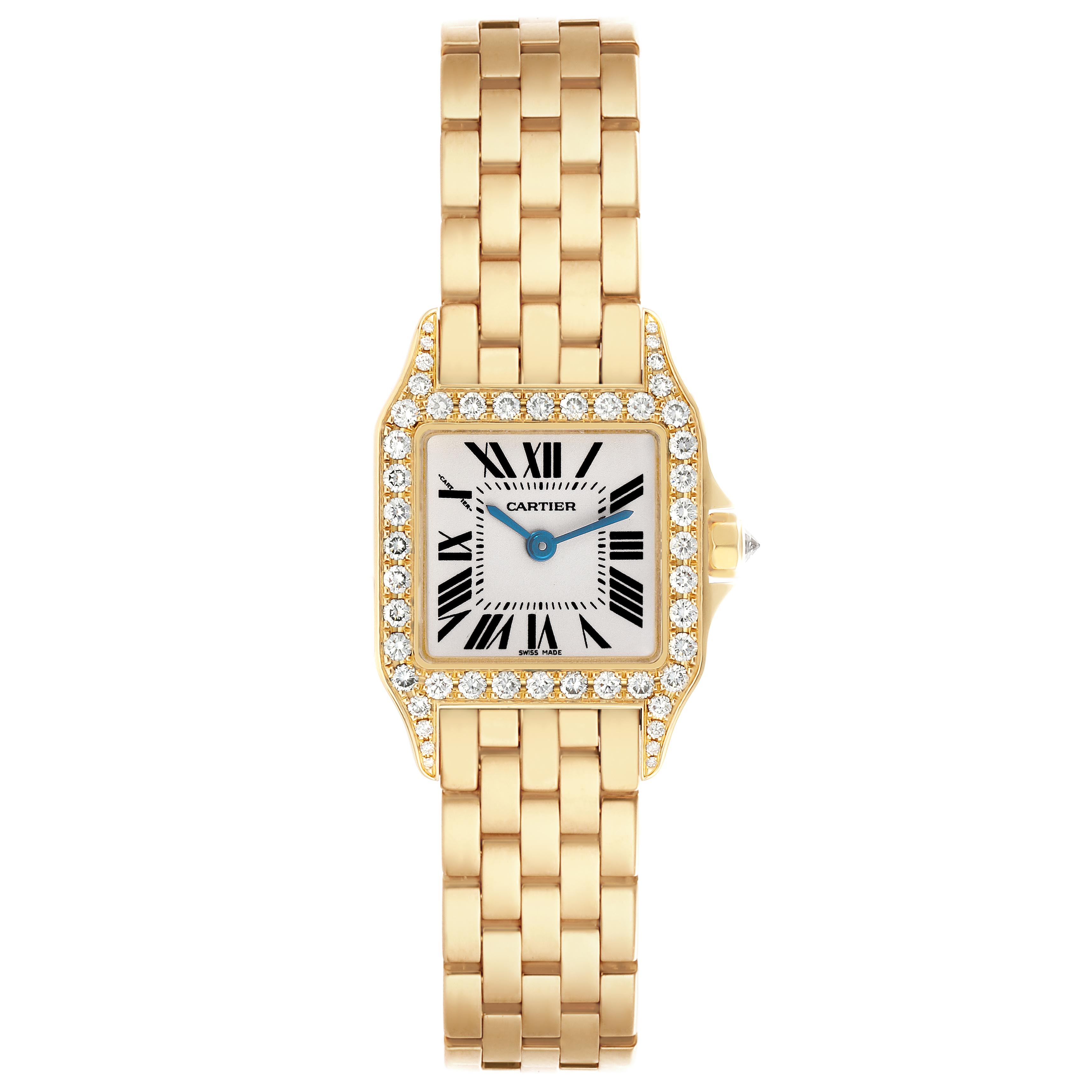 The Cartier Santos Demoiselle WF9001Y7 Women
s Yellow Gold Silver Dial WF9001Y7 Women
s Yellow Gold Silver Dial watch is shown from a top view, highlighting the square dial, diamond bezel, and gold bracelet.