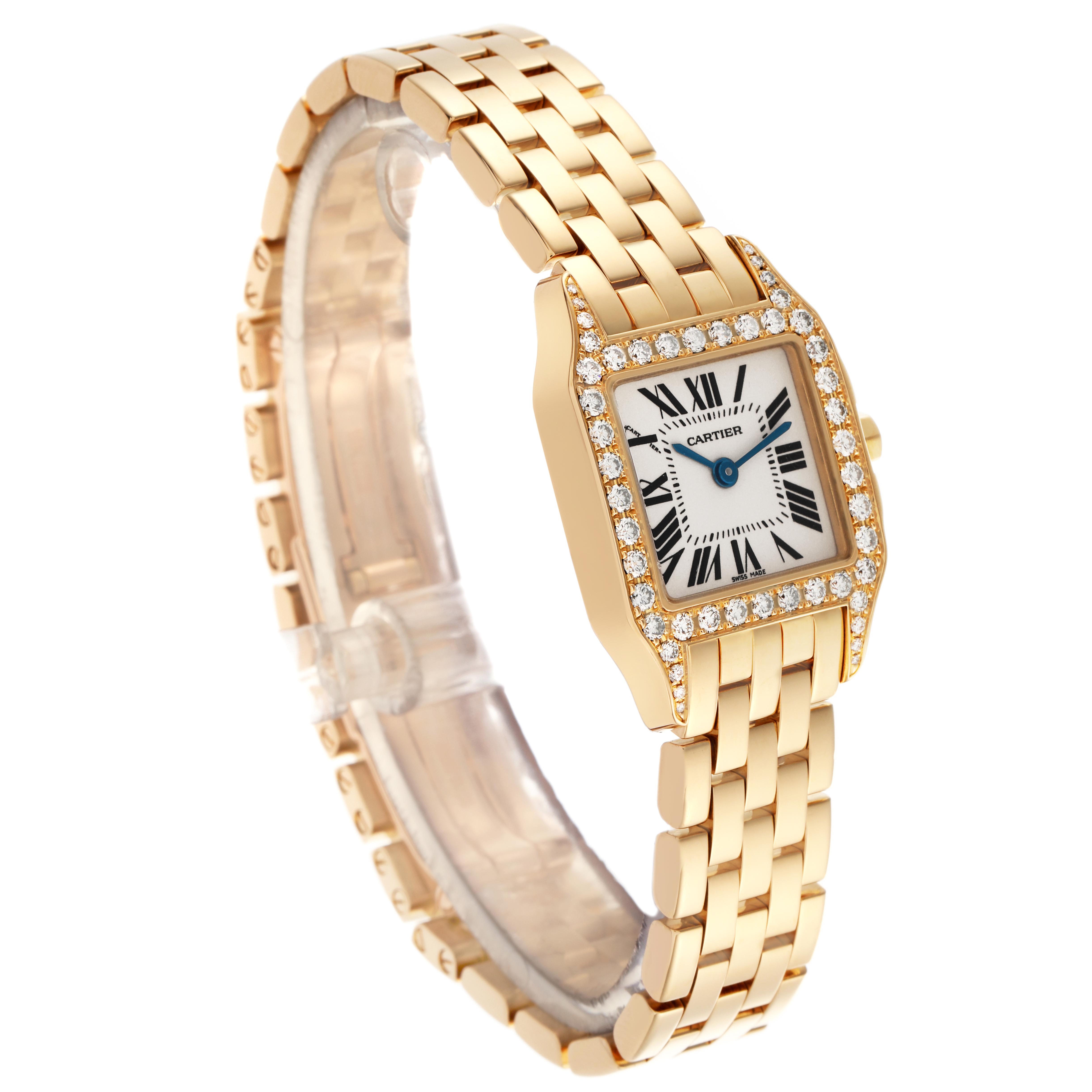The Cartier Santos Demoiselle WF9001Y7 Women
s Yellow Gold Silver Dial WF9001Y7 Women
s Yellow Gold Silver Dial watch is shown at a three-quarter angle, highlighting the face, bezel, and bracelet.