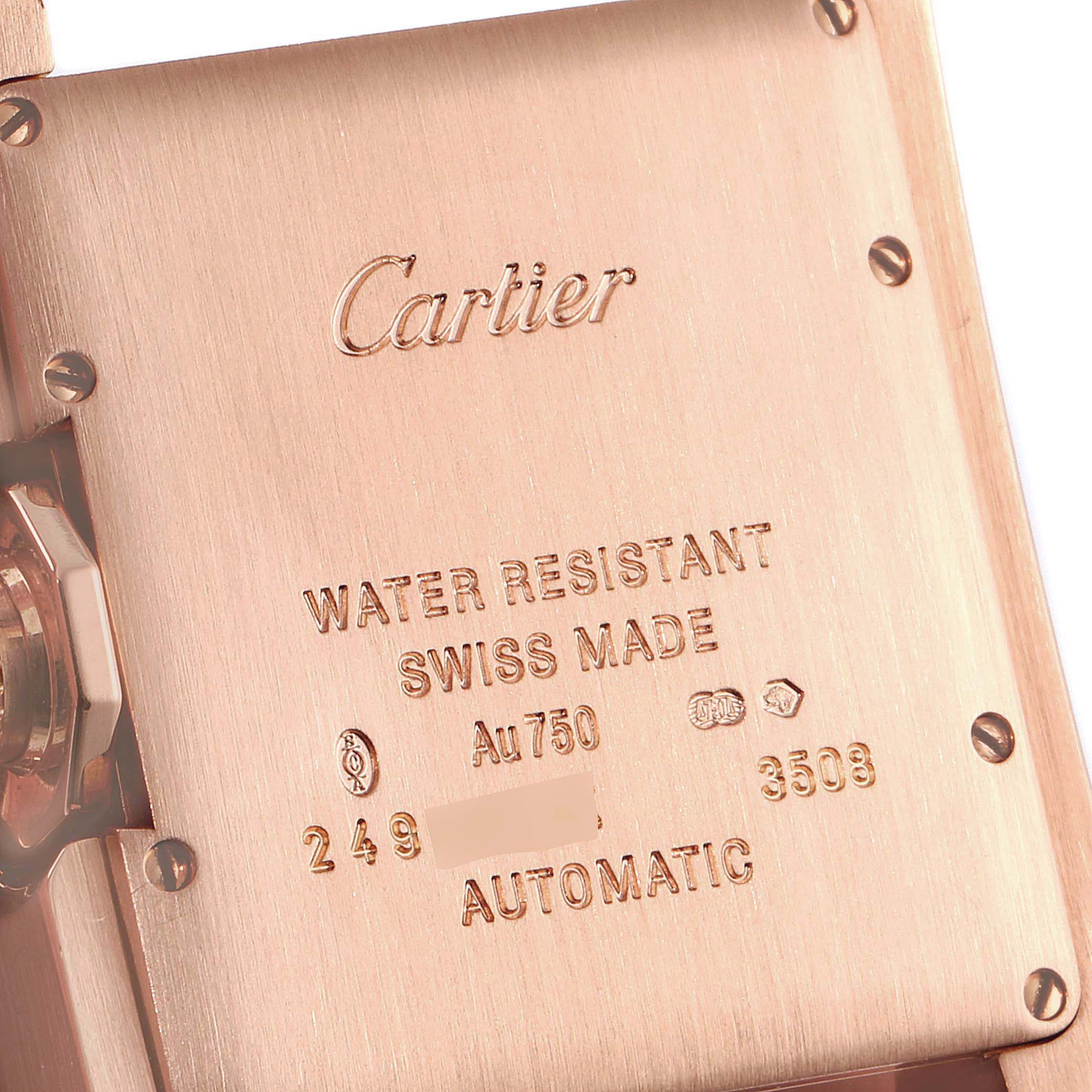 The image shows the back case of a Cartier Tank Anglaise WJTA0004 Women
s Rose Gold Silver Dial WJTA0004 Women
s Rose Gold Silver Dial watch, highlighting inscriptions and screws.