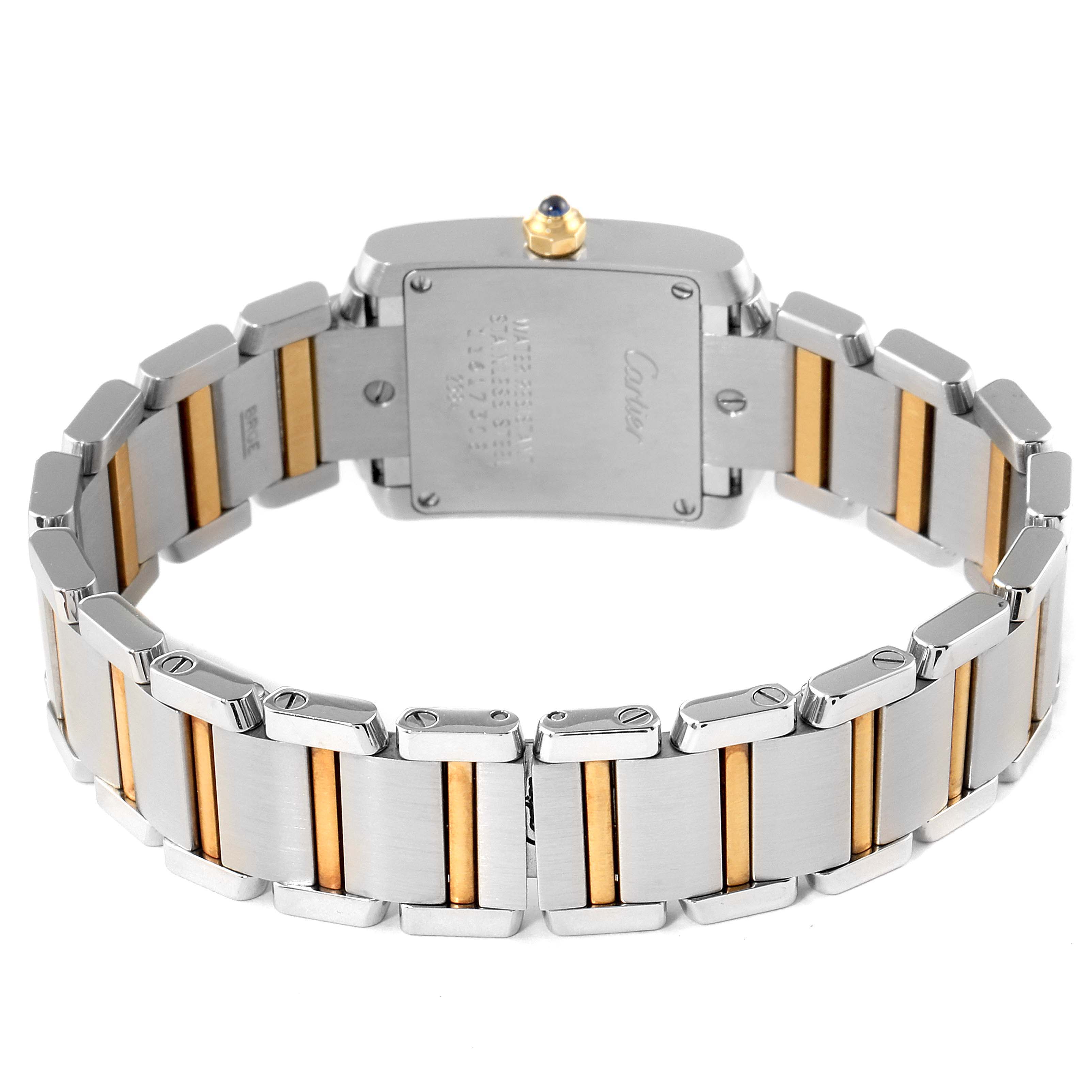 The image shows the back view of a Cartier Tank Francaise W51007Q4 Women's Stainless Steel Silver Dial W51007Q4 Women's Stainless Steel Silver Dial watch, highlighting its stainless steel and gold bracelet.