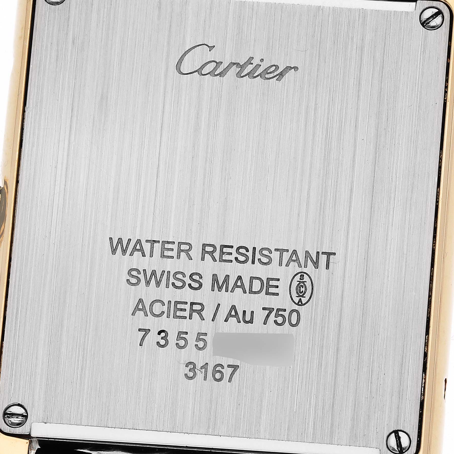 This image shows the back case of the Cartier Tank Solo W5200004 Men's Steel and Gold (two tone) Silver Dial W5200004 Men's Steel and Gold (two tone) Silver Dial watch, highlighting its engravings and screws.