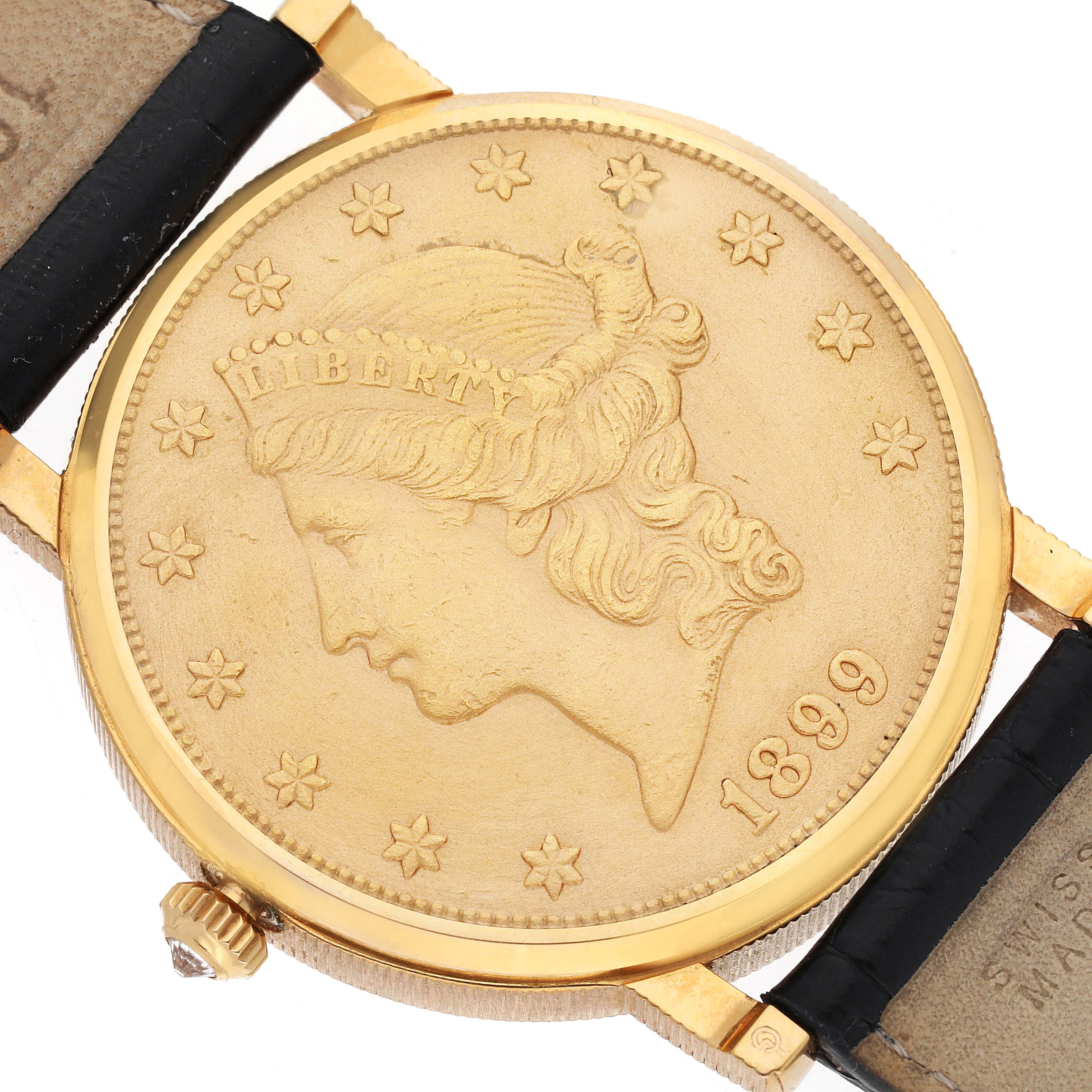 The image shows a close-up of the Corum Coin Watch Men's Yellow Gold Champagne Dial Men's Yellow Gold Champagne Dial model, featuring the coin dial and part of the strap.