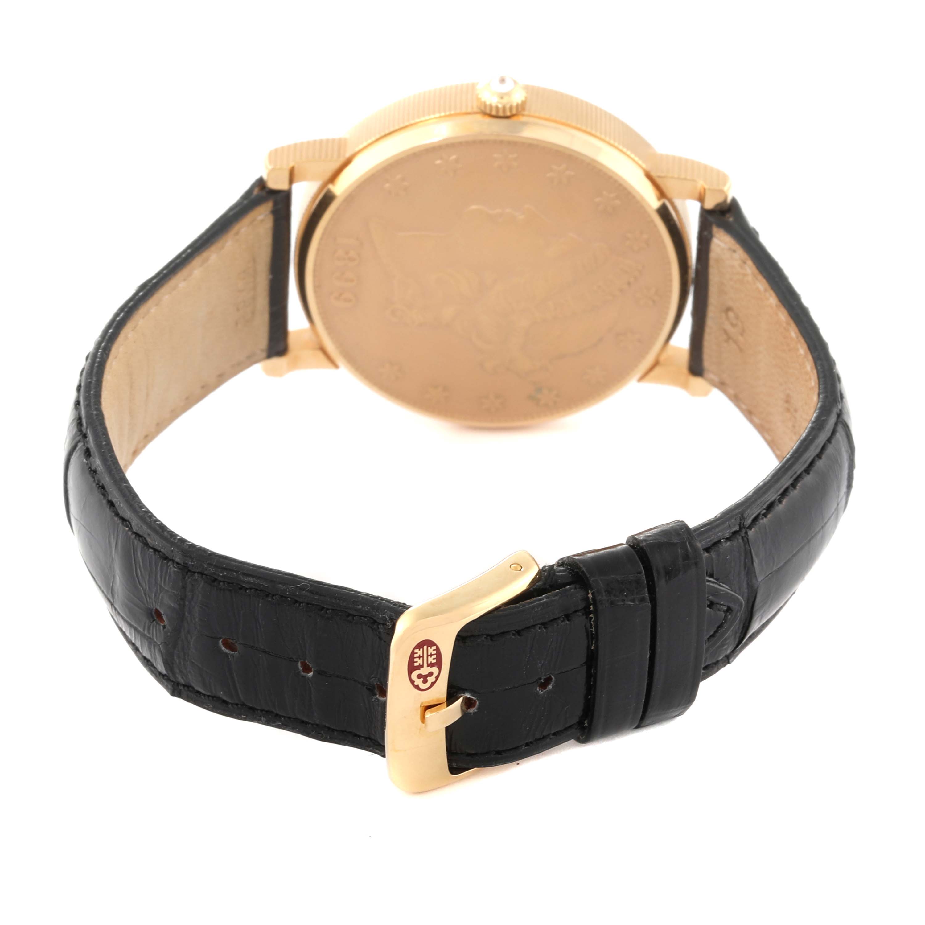 The image shows the back view of the Corum Coin Watch Men's Yellow Gold Champagne Dial Men's Yellow Gold Champagne Dial model displaying the case back, crown, and black leather strap with buckle.