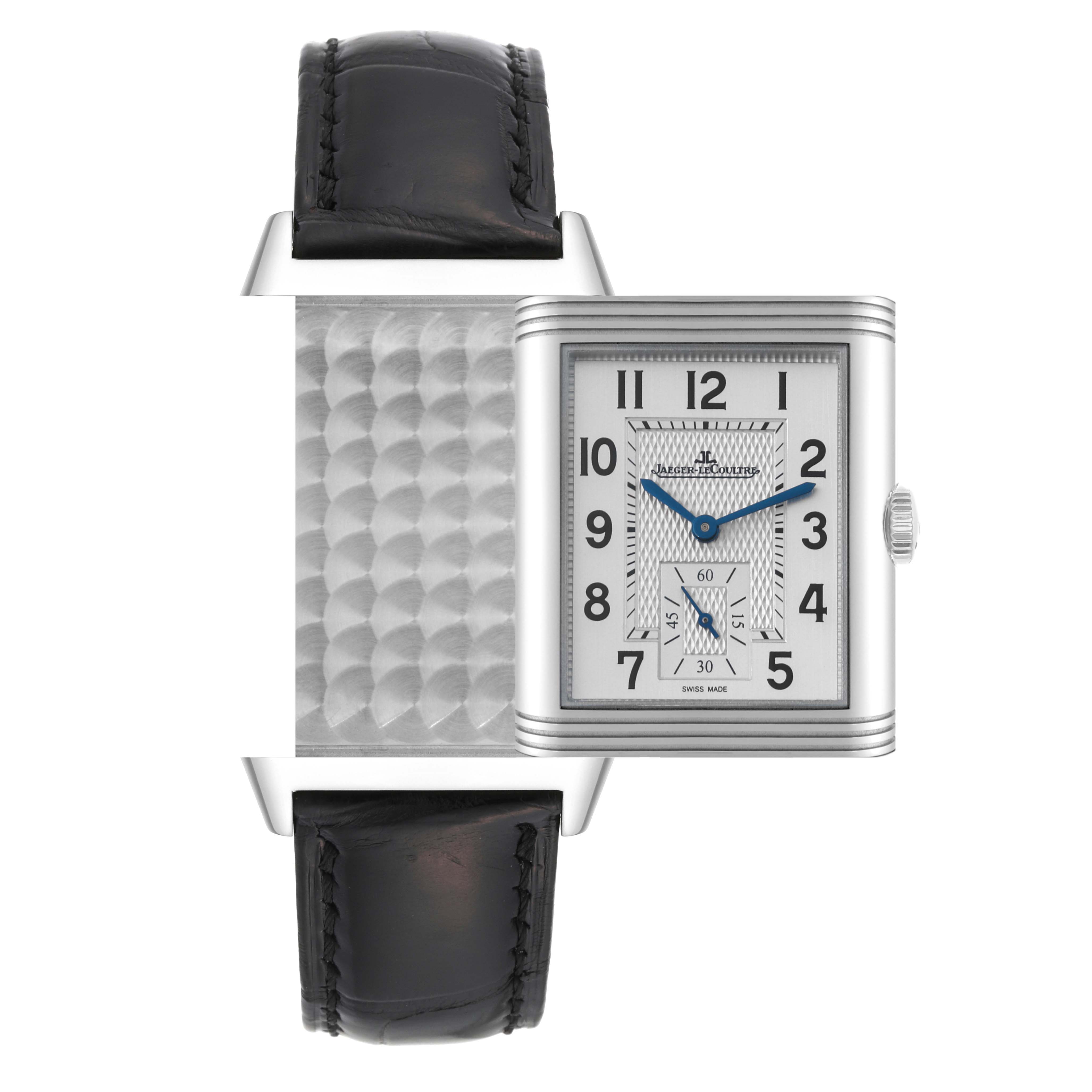 The image shows the Jaeger-LeCoultre Reverso watch, highlighting its reversible case and black leather strap from a front angle.
