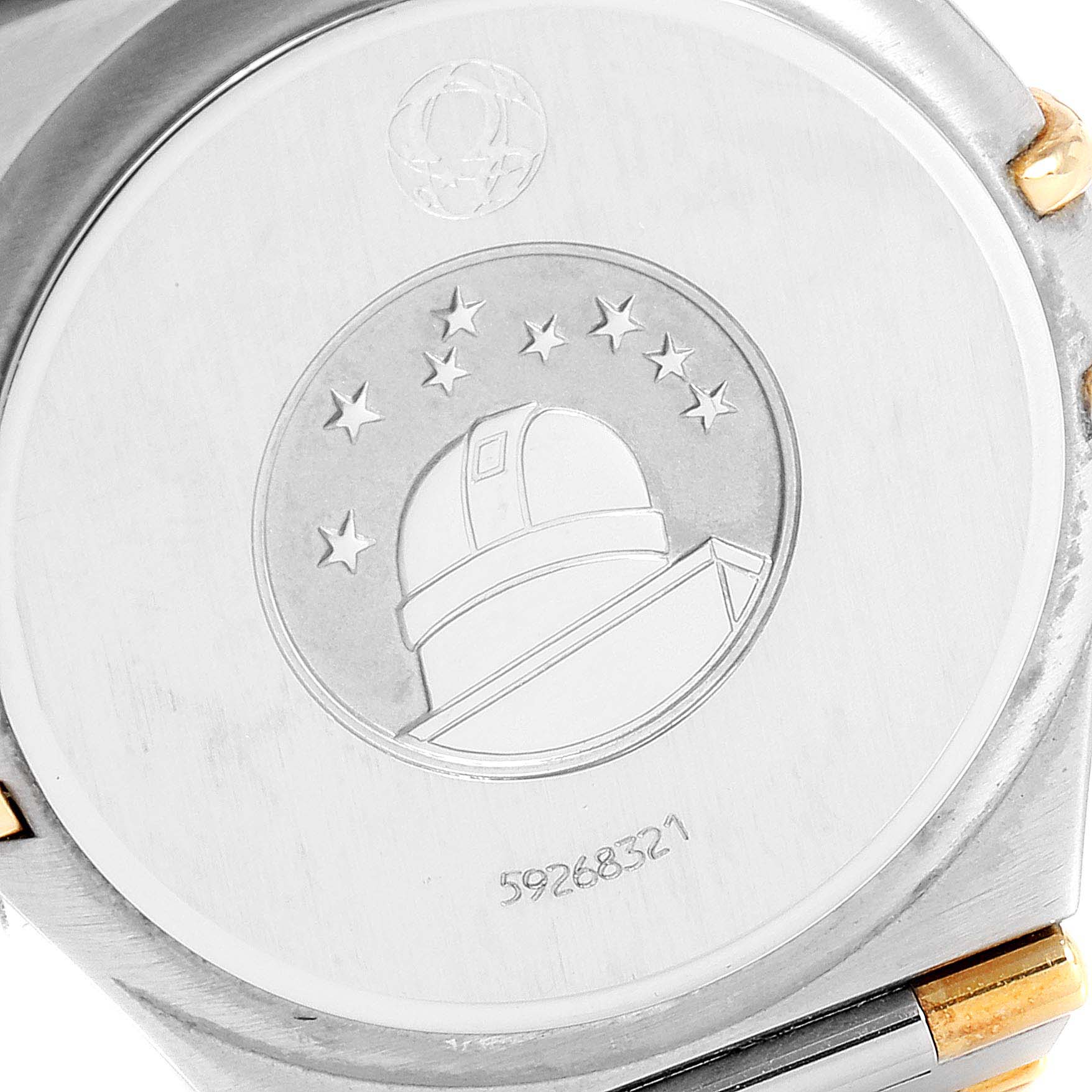 This image shows the back case of an Omega Constellation 1312.30.00 Men's Steel and Gold (two tone) Silver Dial 1312.30.00 Men's Steel and Gold (two tone) Silver Dial watch, featuring the observatory logo and series number.