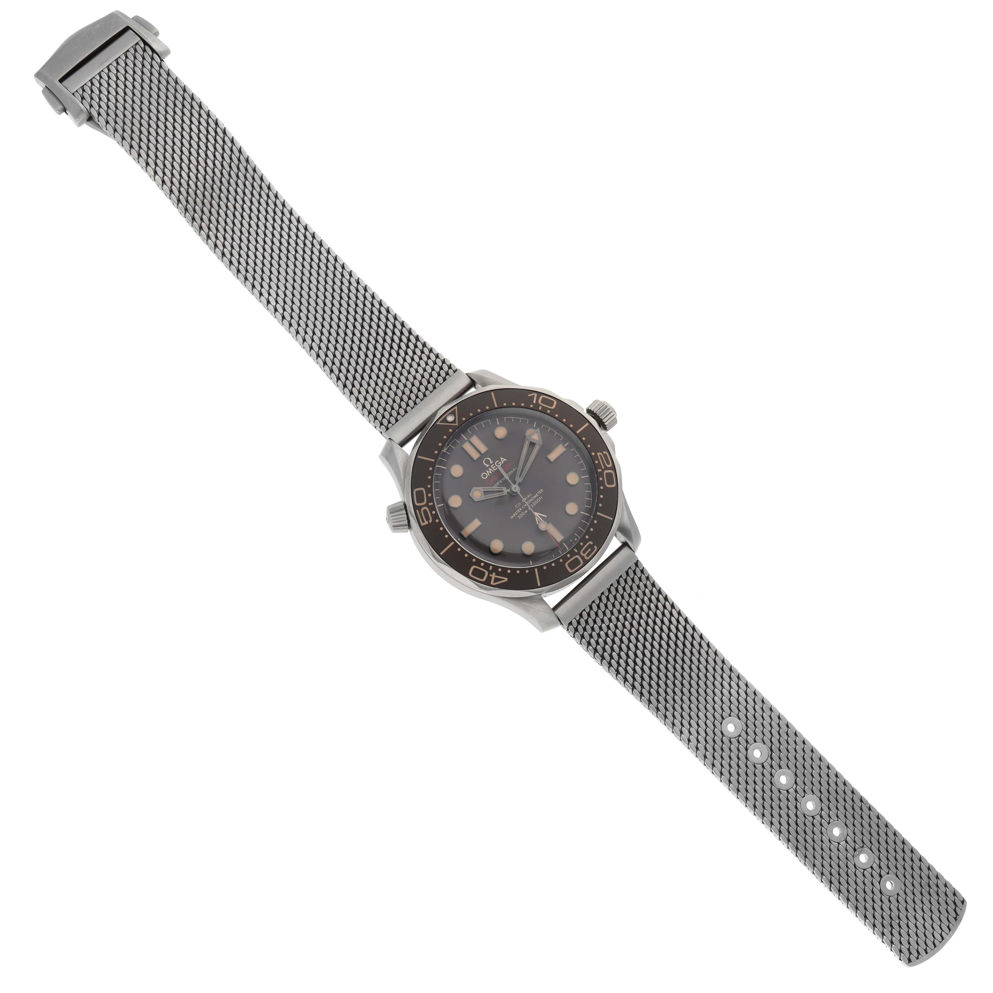 The Omega Seamaster 210.90.42.20.01.001 Men's Titanium Black Dial 210.90.42.20.01.001 Men's Titanium Black Dial watch is shown from a top-down angle, displaying its face, bezel, and metal mesh strap.