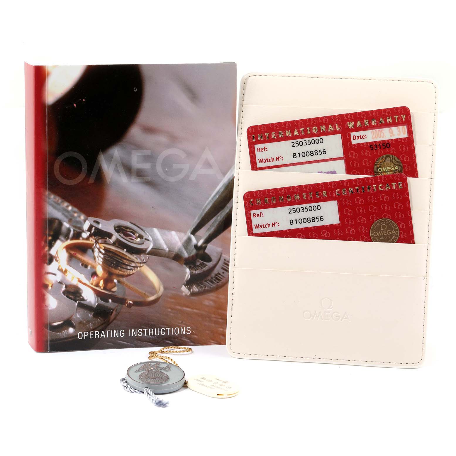 The image shows the Omega Aqua Terra 2503.50.00 Men
s Stainless Steel Black Dial 2503.50.00 Men
s Stainless Steel Black Dial watch
s operating instructions, warranty cards, and tags.