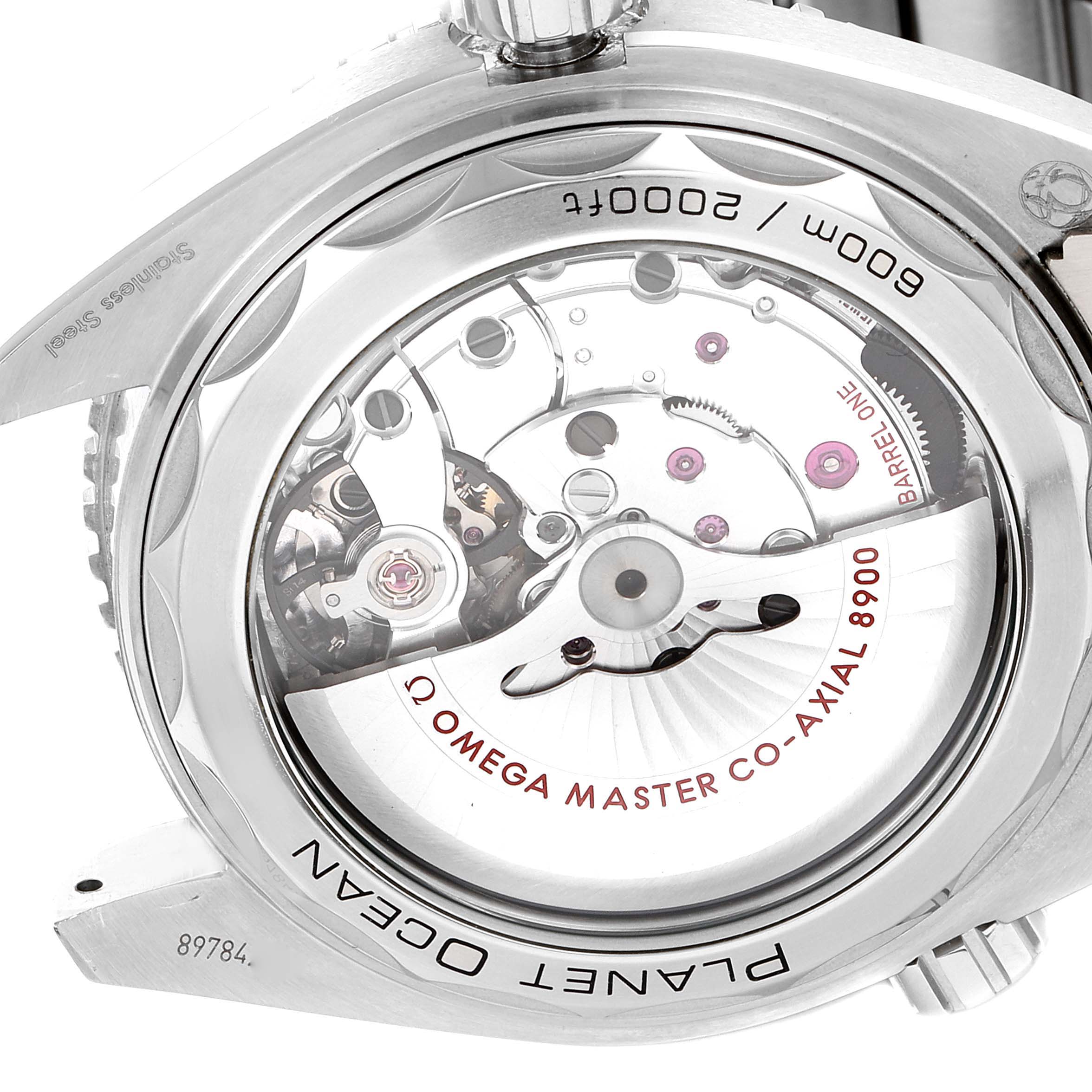 The image shows the back view of the Omega Planet Ocean 215.30.44.21.01.001 Men's Stainless Steel Black Dial 215.30.44.21.01.001 Men's Stainless Steel Black Dial watch, highlighting the Co-Axial 8900 movement inside.