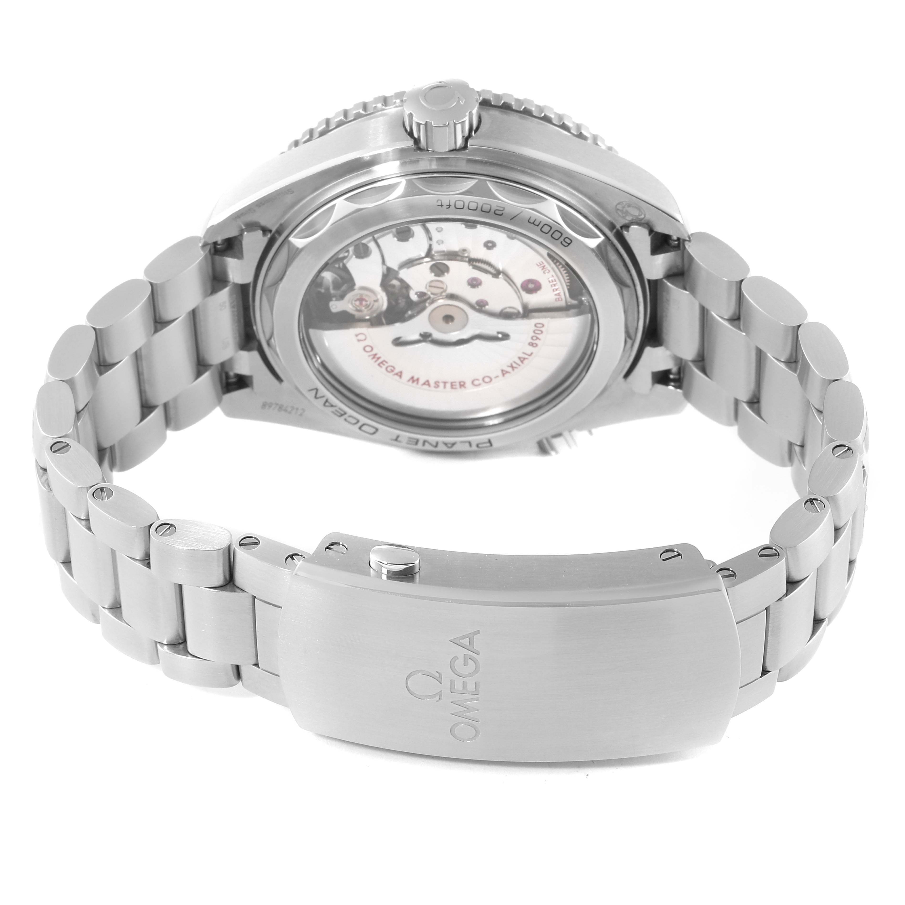 The image shows the back and bracelet of an Omega Planet Ocean 215.30.44.21.01.001 Men's Stainless Steel Black Dial 215.30.44.21.01.001 Men's Stainless Steel Black Dial watch, focusing on its clasp and exposed movement.