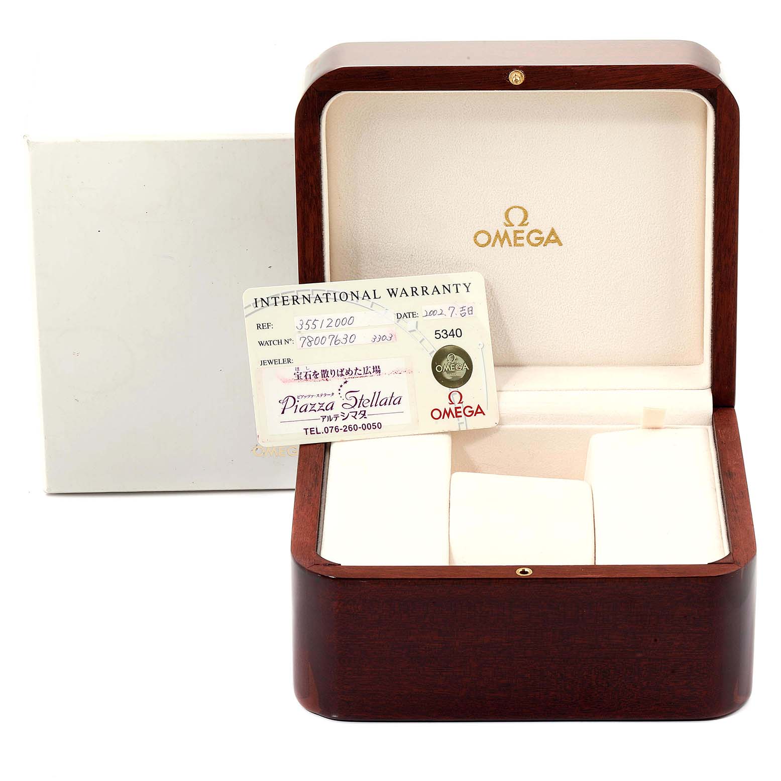 The image shows an Omega Speedmaster 3551.20.00 Men's Stainless Steel White Dial 3551.20.00 Men's Stainless Steel White Dial watch box with an international warranty card displayed inside from the front angle.