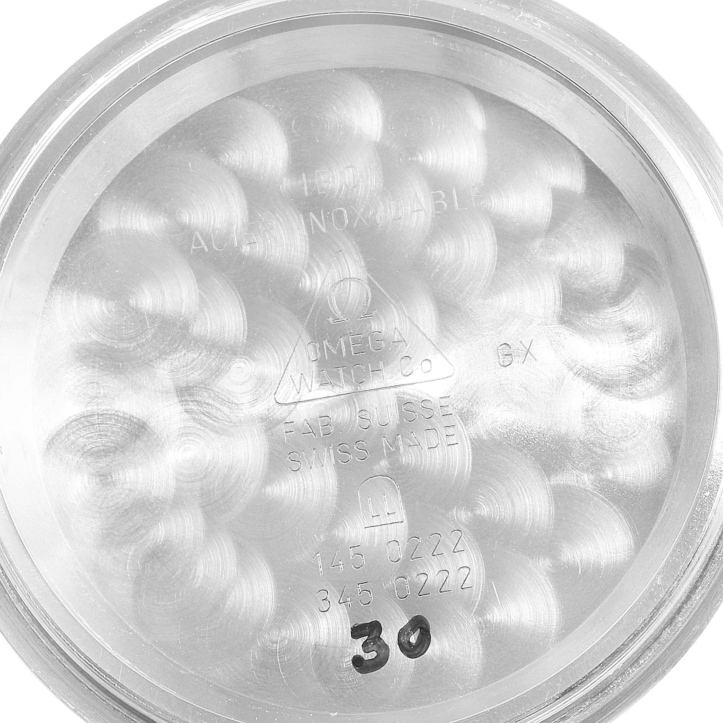 This image shows the inside case back of an Omega Speedmaster 3594.50.00 Men
s Stainless Steel Black Dial 3594.50.00 Men
s Stainless Steel Black Dial watch, displaying engravings and model numbers.