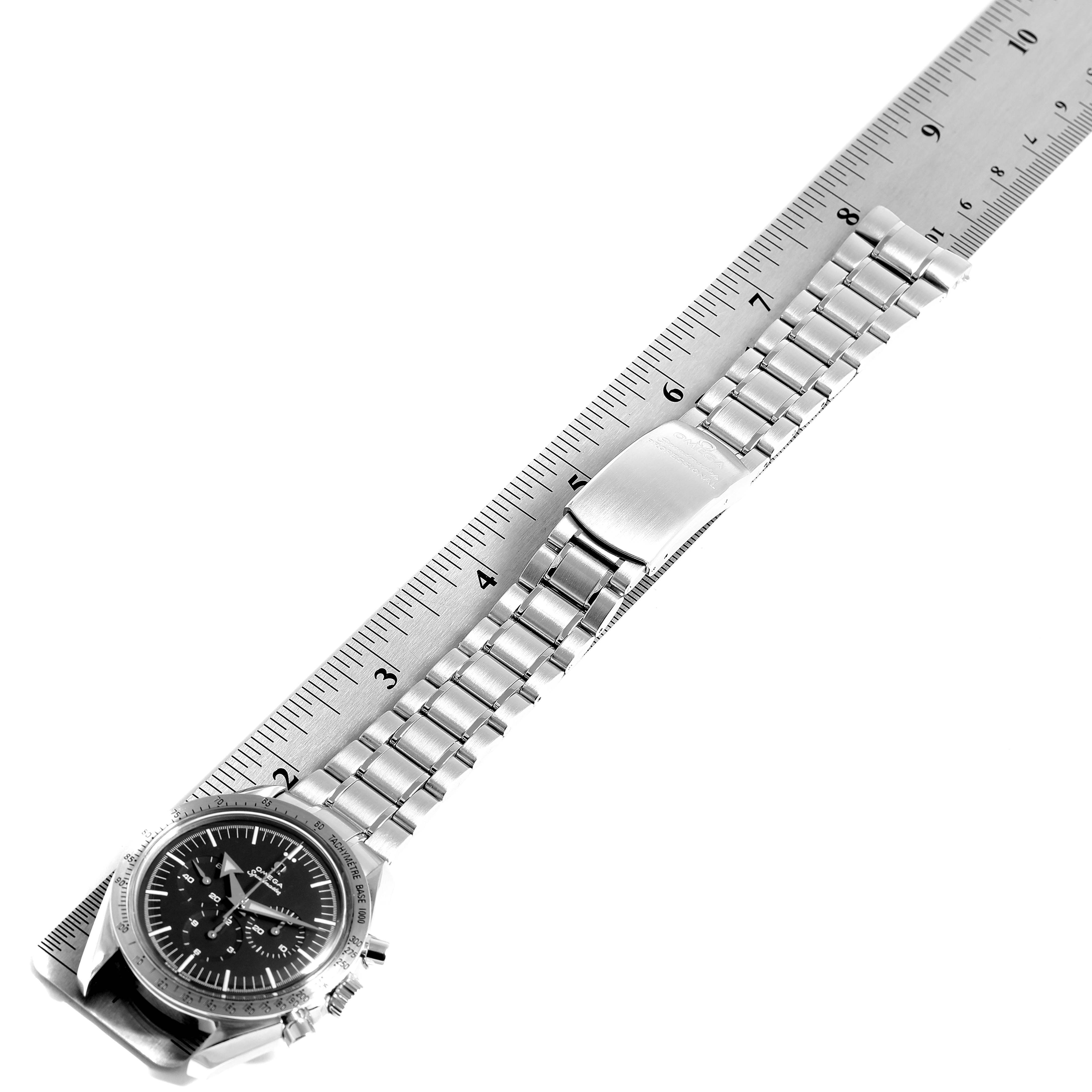 The image shows an Omega Speedmaster 3594.50.00 Men
s Stainless Steel Black Dial 3594.50.00 Men
s Stainless Steel Black Dial watch laid flat, with the face, stainless steel bracelet, and clasp visible, aligned with a ruler.