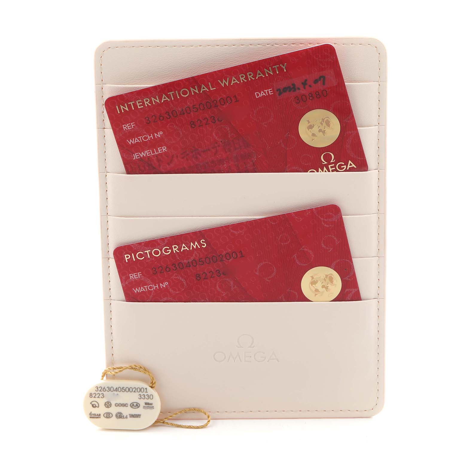 The image shows Omega Speedmaster 326.30.40.50.02.001 Men
s Stainless Steel Silver Dial 326.30.40.50.02.001 Men
s Stainless Steel Silver Dial accessories including warranty and pictogram cards in a cardholder, along with a tag.