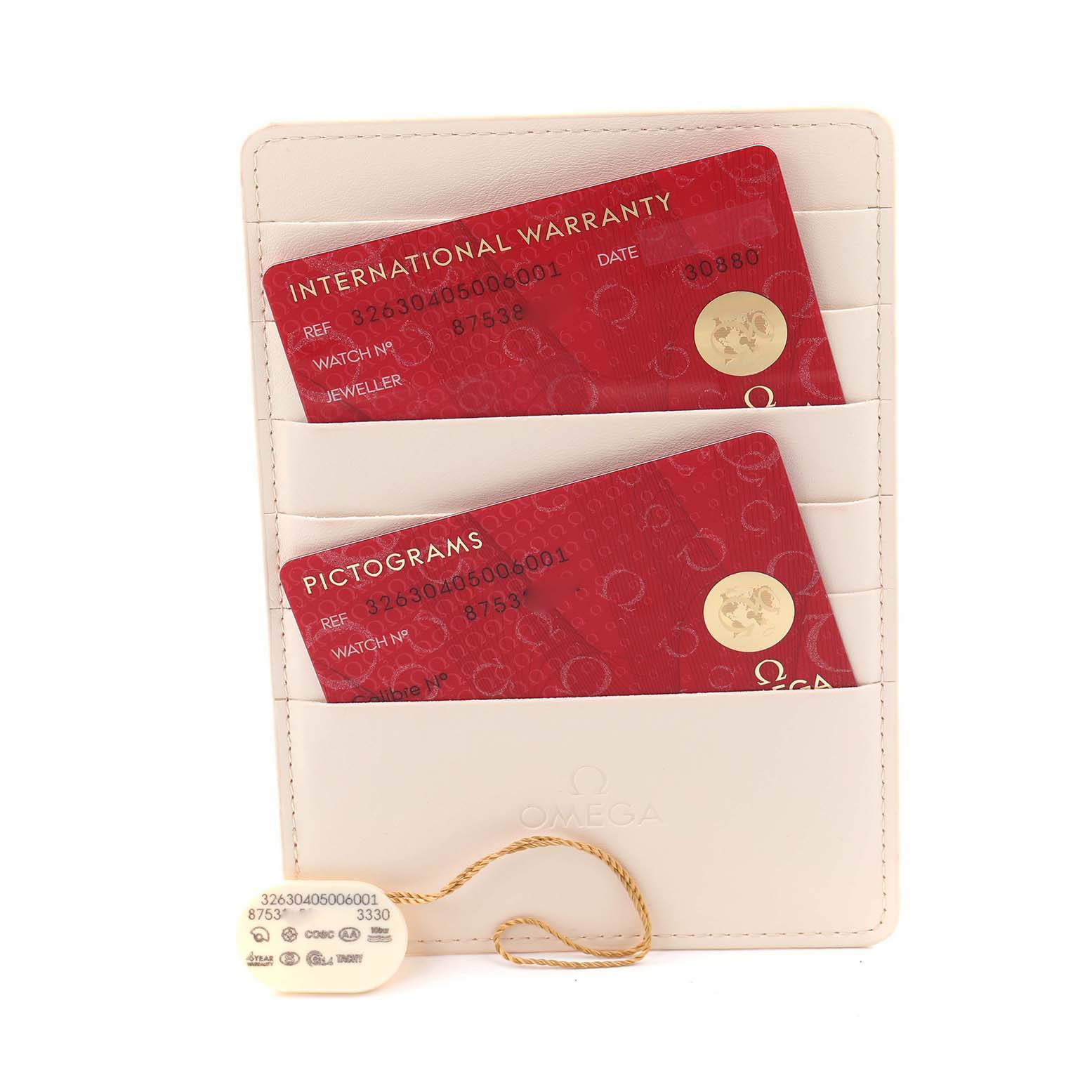 The image shows Omega Speedmaster 326.30.40.50.06.001 Men
s Stainless Steel Grey Dial 326.30.40.50.06.001 Men
s Stainless Steel Grey Dial
s warranty and pictogram cards in a cardholder, along with a tag.