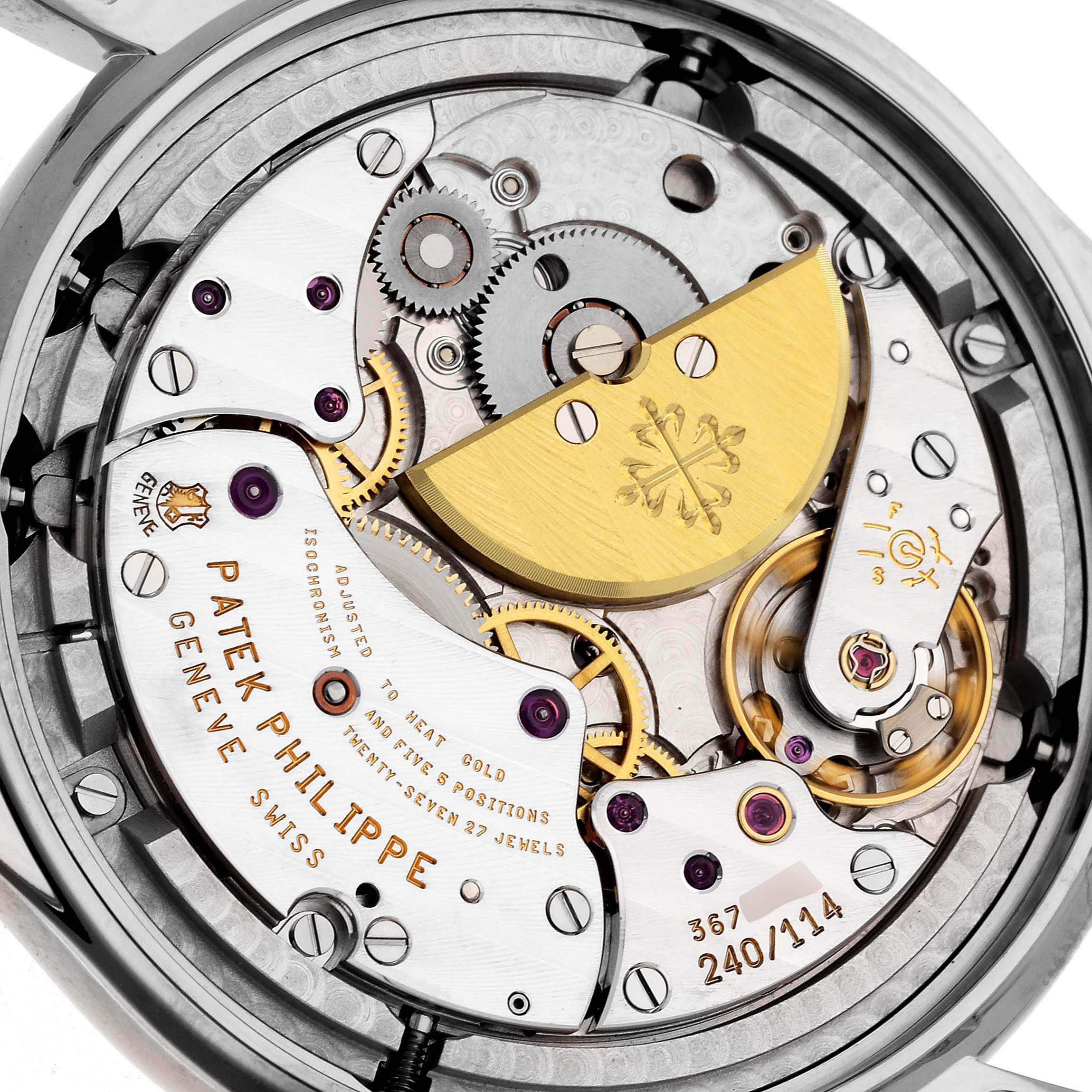 The image shows the intricate back mechanism of a Patek Philippe Calatrava 5140G-001 Men
s White Gold Silver Dial 5140G-001 Men
s White Gold Silver Dial watch, highlighting gears, screws, and the signature gold rotor.
