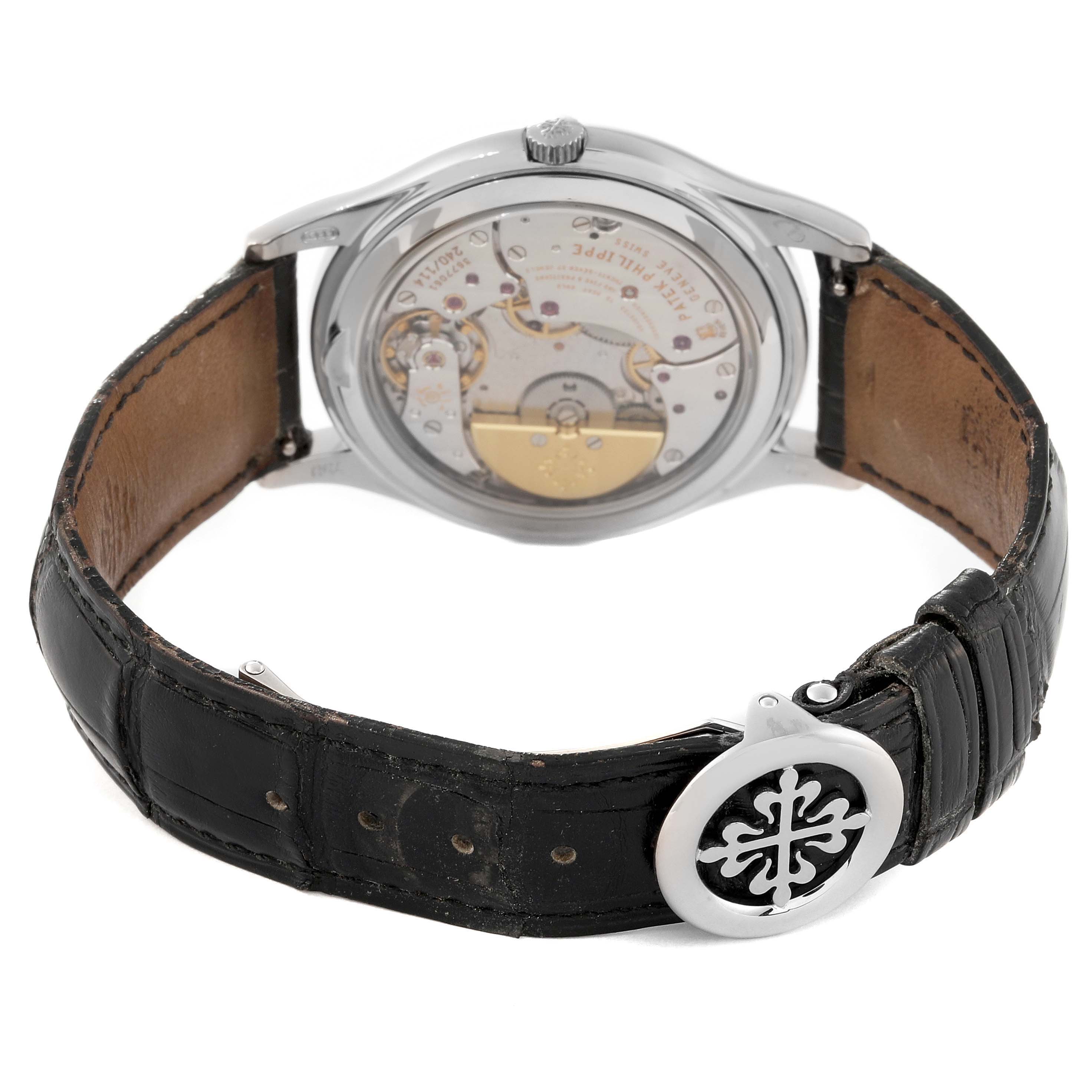 The image shows the back view of a Patek Philippe Calatrava 5140G-001 Men
s White Gold Silver Dial 5140G-001 Men
s White Gold Silver Dial watch, highlighting its movement and leather strap.