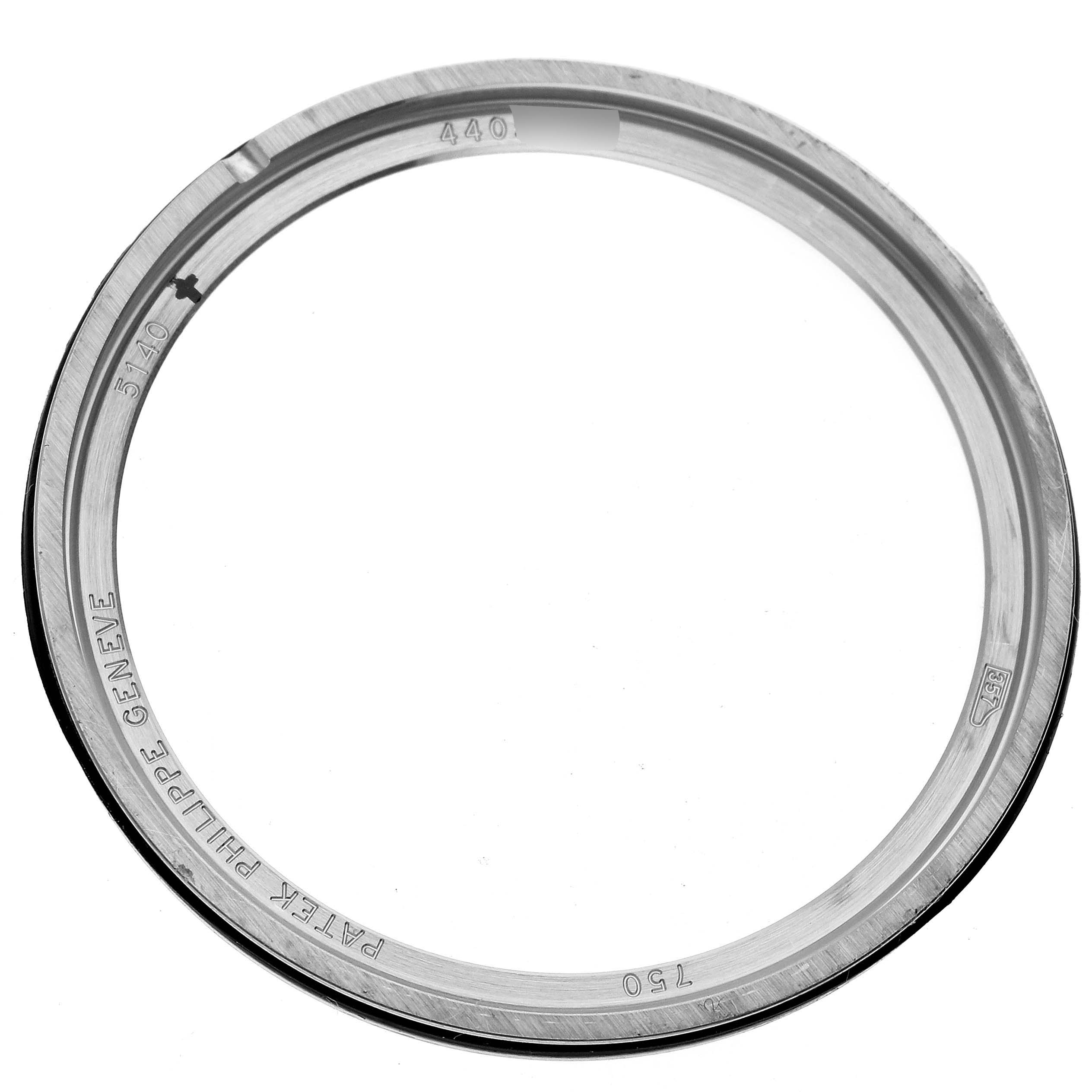 The image shows a close-up of the bezel for a Patek Philippe Calatrava 5140G-001 Men
s White Gold Silver Dial 5140G-001 Men
s White Gold Silver Dial watch.