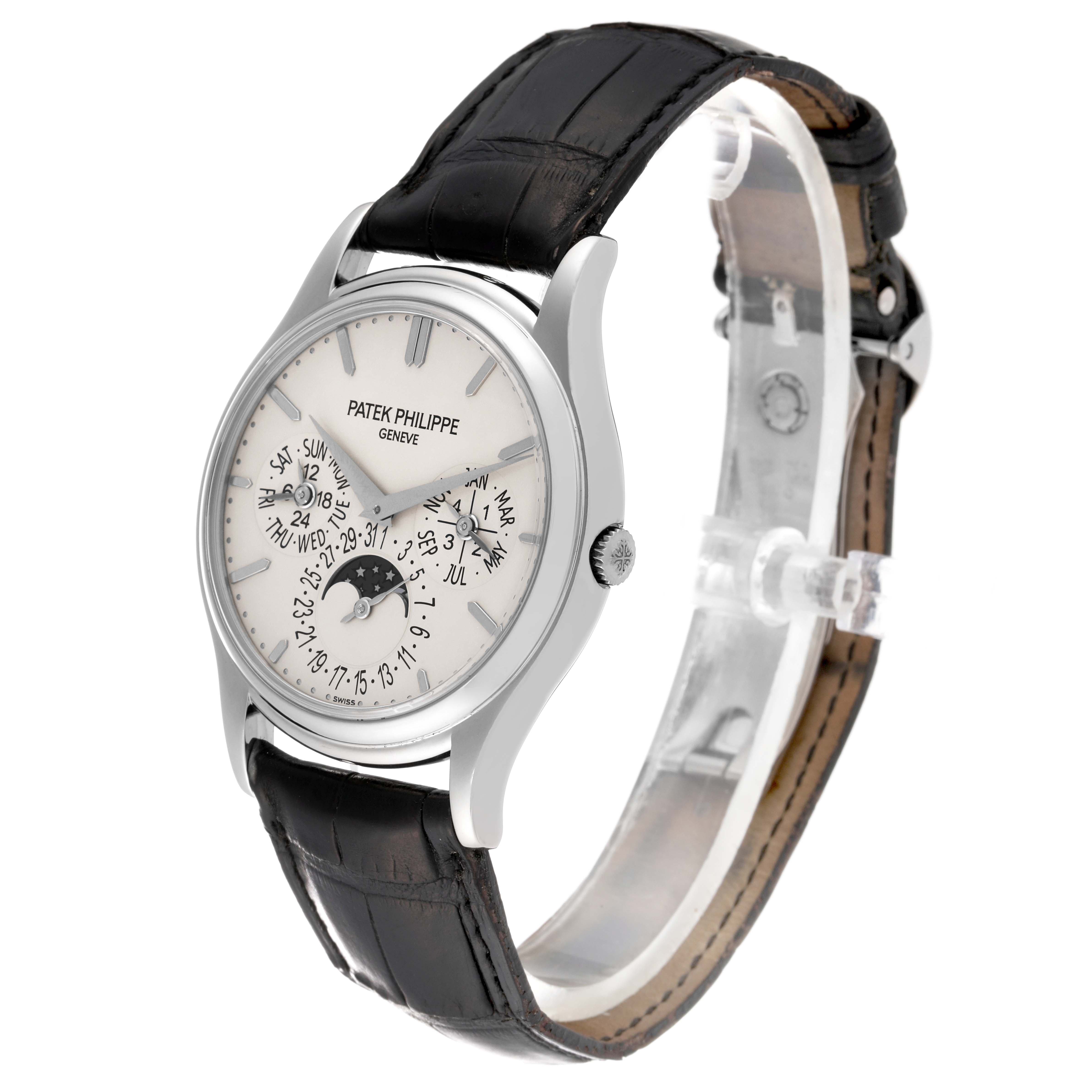 The image shows a Patek Philippe Calatrava 5140G-001 Men
s White Gold Silver Dial 5140G-001 Men
s White Gold Silver Dial model watch from a front angle, highlighting its dial, case, and leather strap.