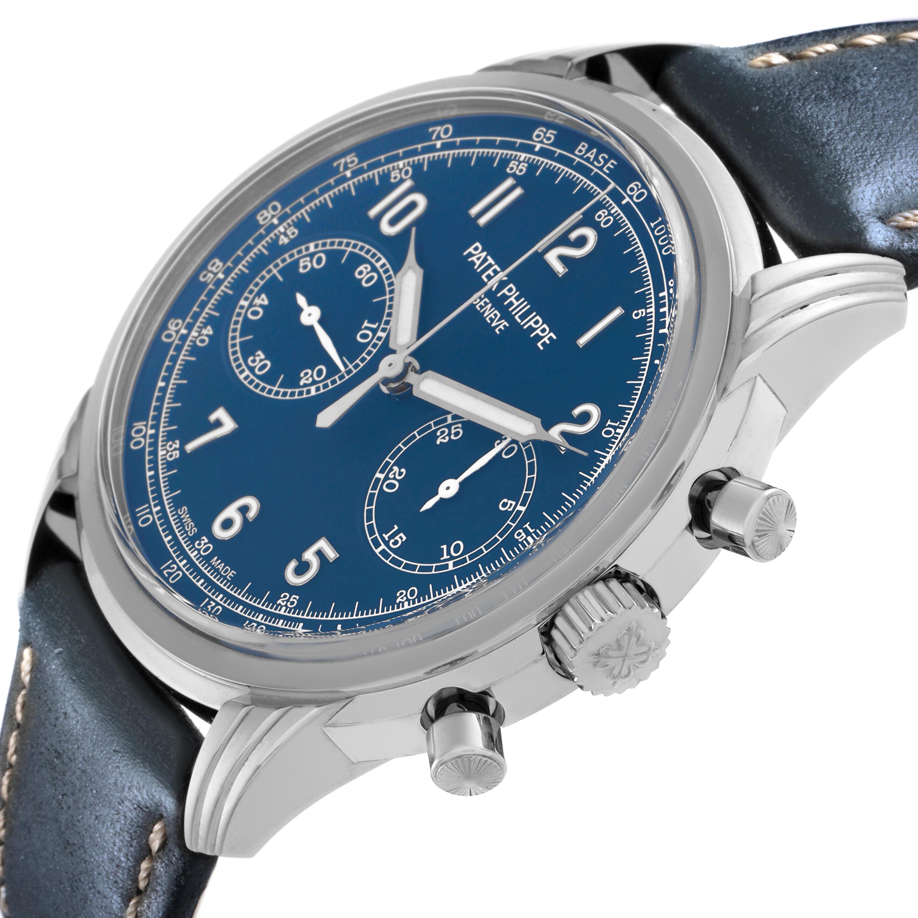 The Patek Philippe Complications 5172G-001 Men
s White Gold Blue Dial 5172G-001 Men
s White Gold Blue Dial watch is shown at an angled side view, highlighting the dial, crown, pushers, and leather strap.