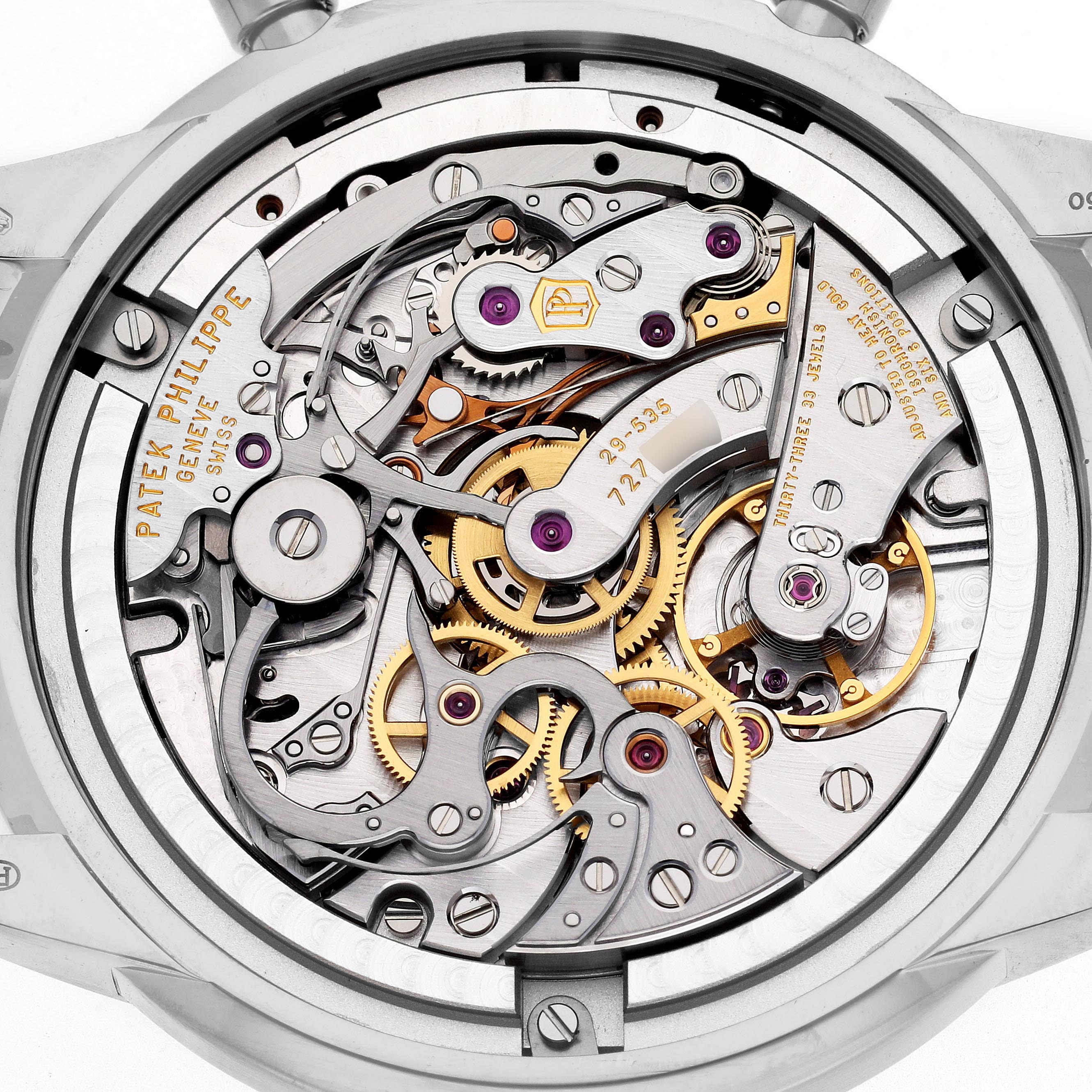 The image shows a close-up of the intricate movement of a Patek Philippe Complications 5172G-001 Men
s White Gold Blue Dial 5172G-001 Men
s White Gold Blue Dial watch, highlighting gears and mechanisms.