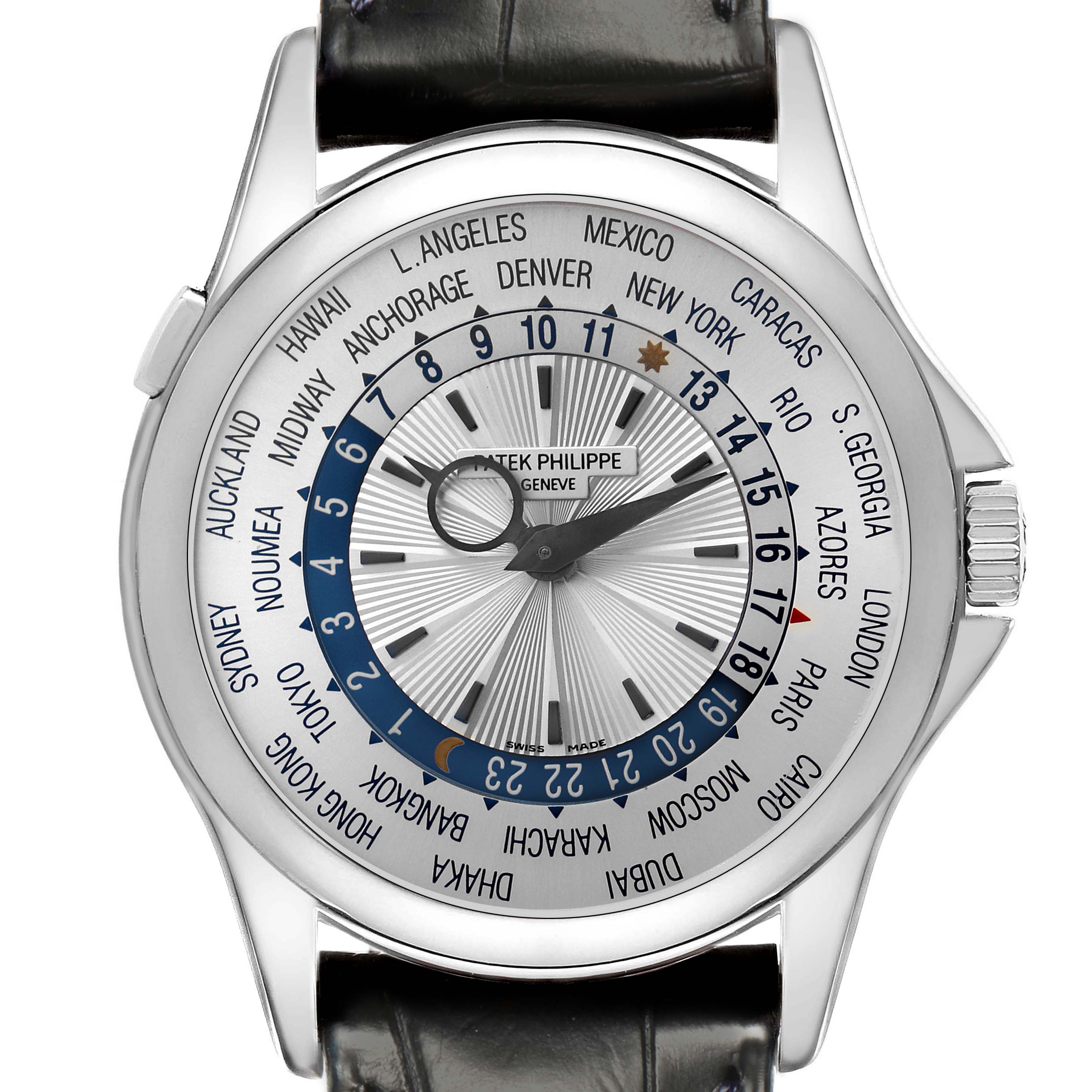 The Patek Philippe Complications 5130G-001 Men
s White Gold Silver Dial 5130G-001 Men
s White Gold Silver Dial watch is shown from a top-down angle, highlighting the world time dial and black leather strap.