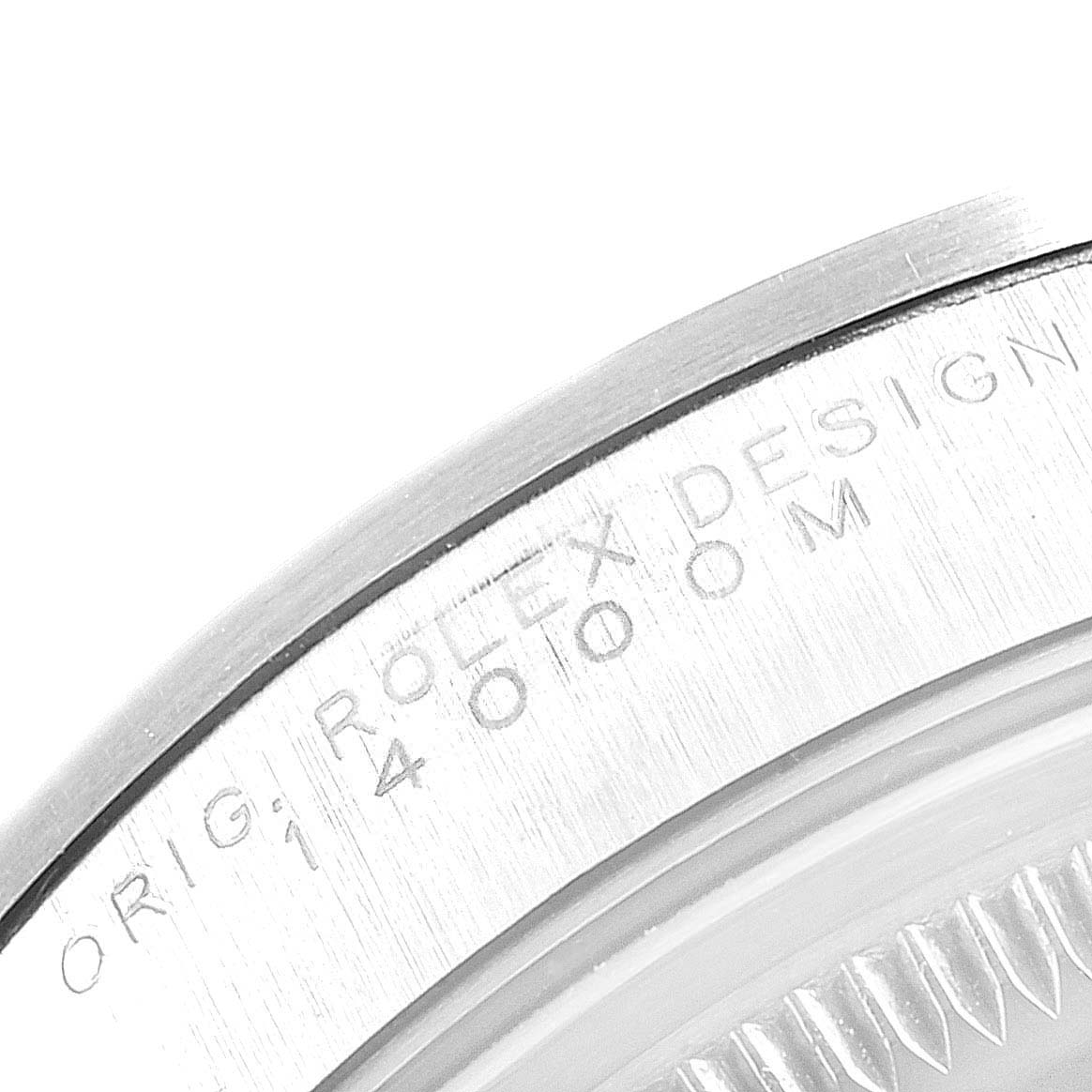 The image shows a close-up of the case back edge of a Rolex Air-King 14000 Men's Stainless Steel Silver Dial 14000 Men's Stainless Steel Silver Dial watch, displaying part of the engraved text.