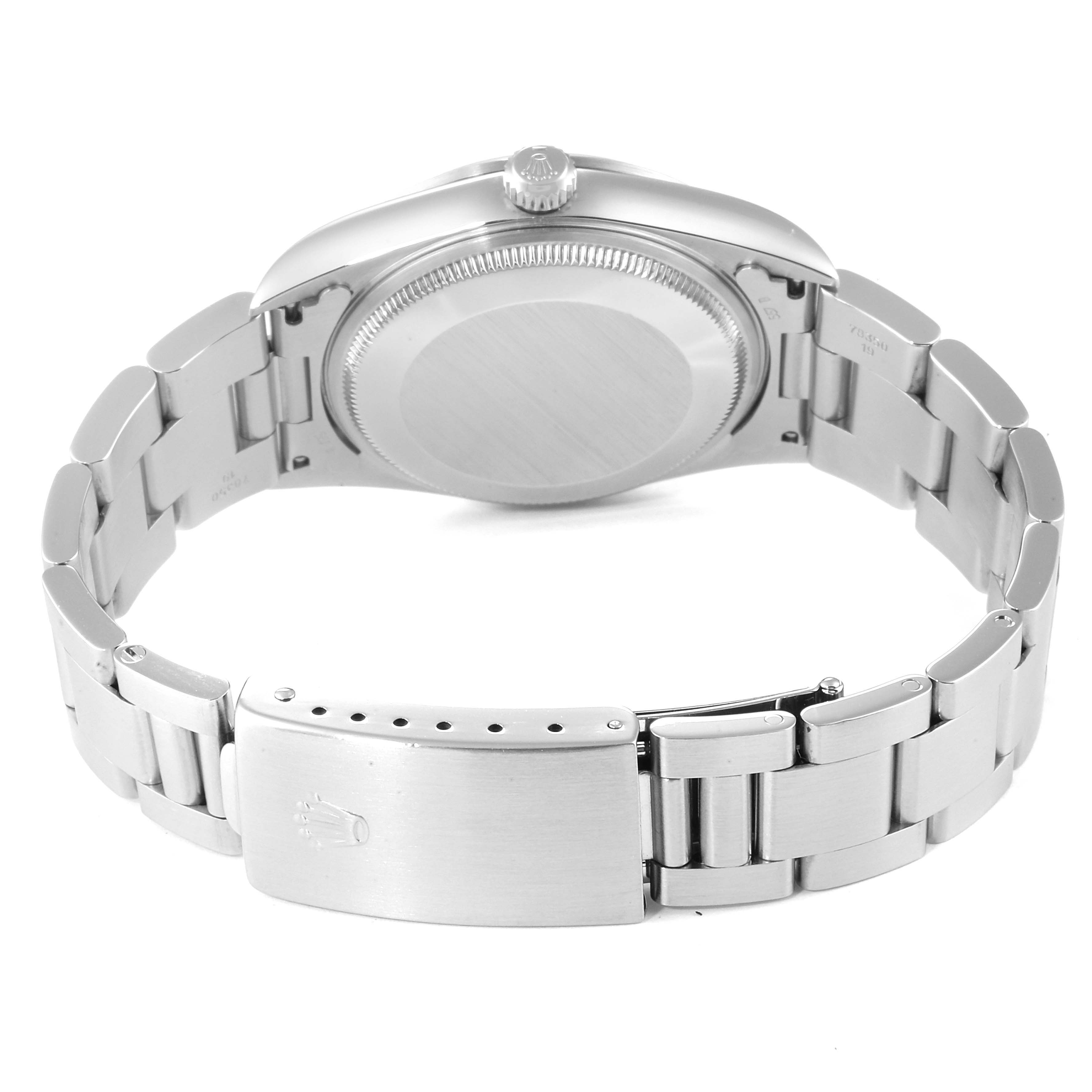 The image shows the back of a Rolex Air-King 14000 Men's Stainless Steel White Dial 14000 Men's Stainless Steel White Dial watch and its stainless steel bracelet with the clasp open. 