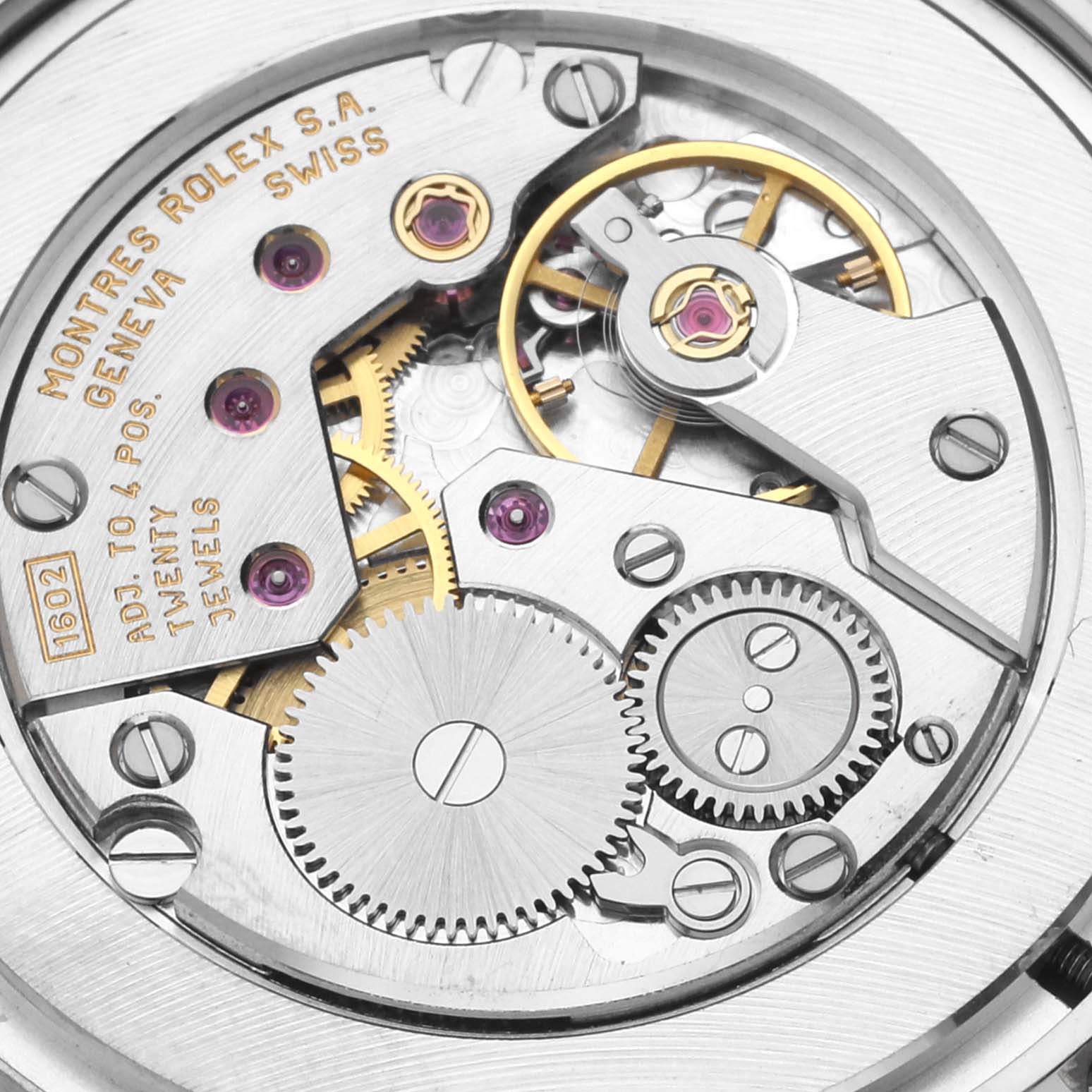 This image shows the intricate inner mechanism of the Rolex Cellini 5115/9 Men's White Gold Silver Dial 5115/9 Men's White Gold Silver Dial model, highlighting gears and jewels.