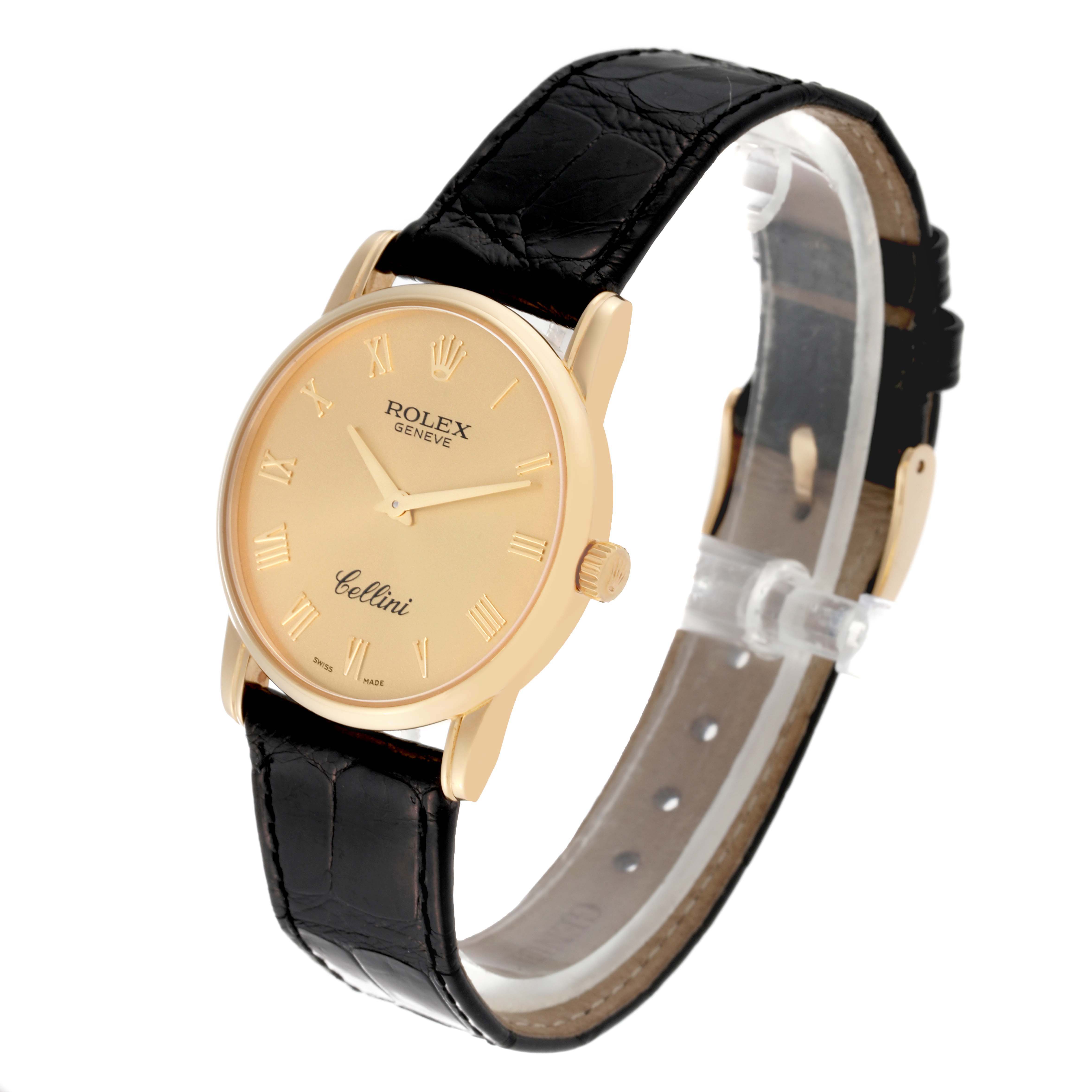 The Rolex Cellini 5116 Men's Yellow Gold Champagne Dial 5116 Men's Yellow Gold Champagne Dial watch is shown at a three-quarter angle, displaying the gold dial, leather strap, and side crown.